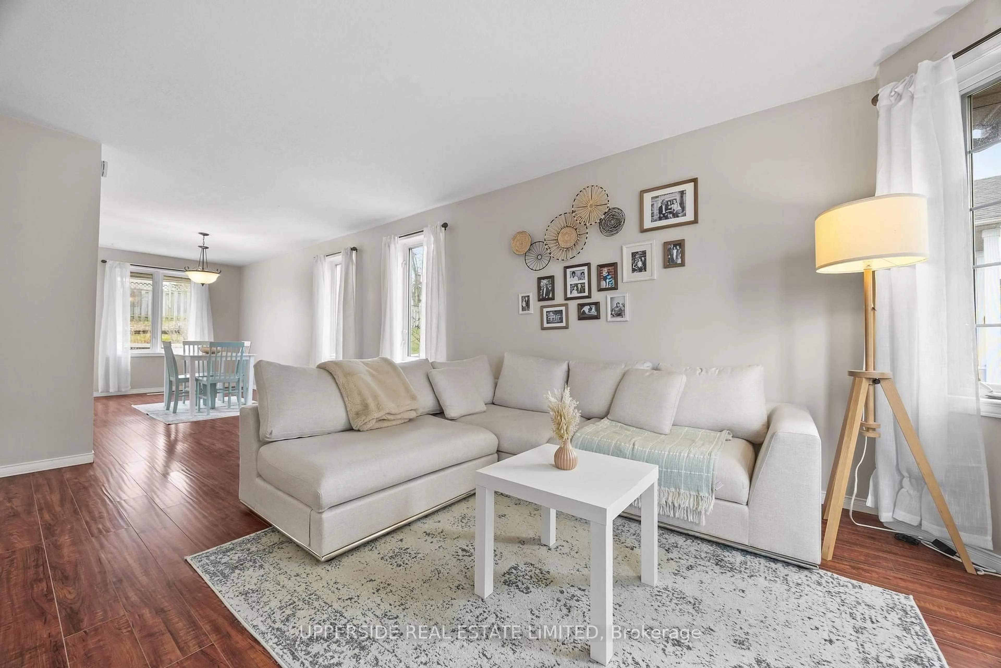 Living room with furniture, wood/laminate floor for 69 Abbeywood Cres, Guelph Ontario N1K 1V3