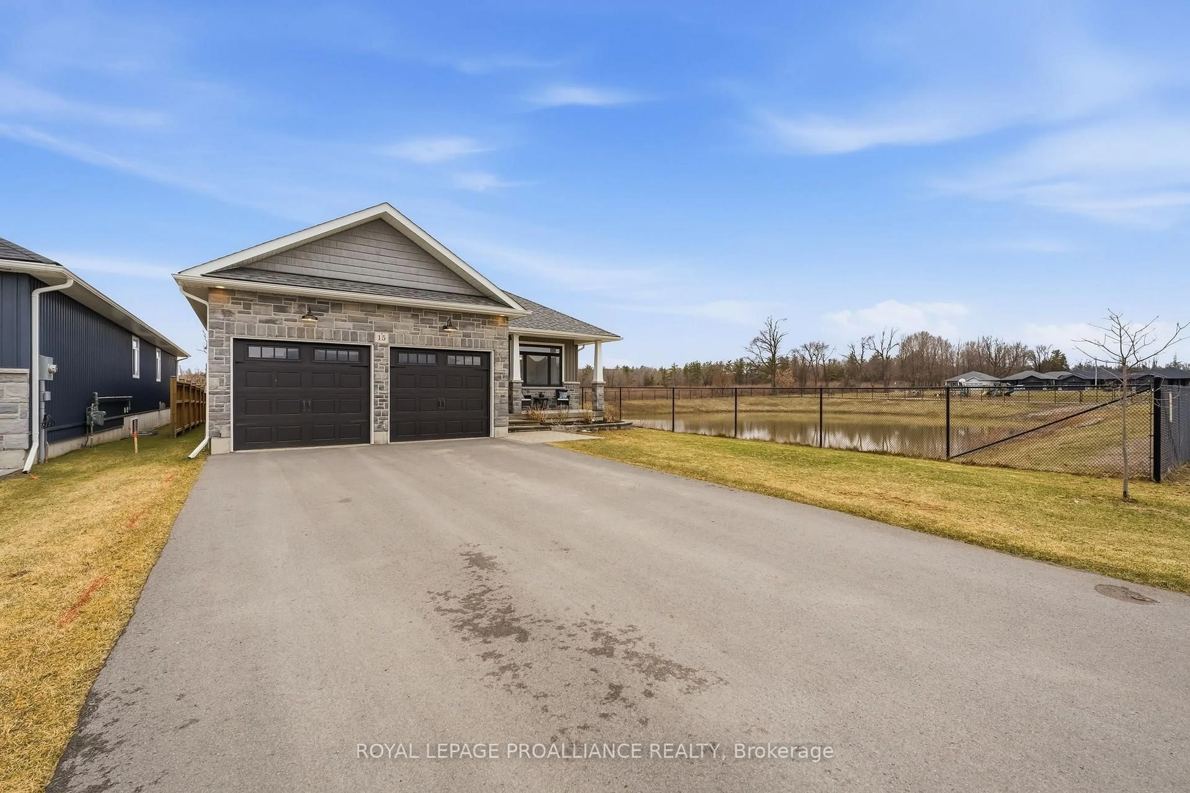 A pic from outside/outdoor area/front of a property/back of a property/a pic from drone, water/lake/river/ocean view for 15 Ambrosia Terr, Quinte West Ontario K8V 0G7