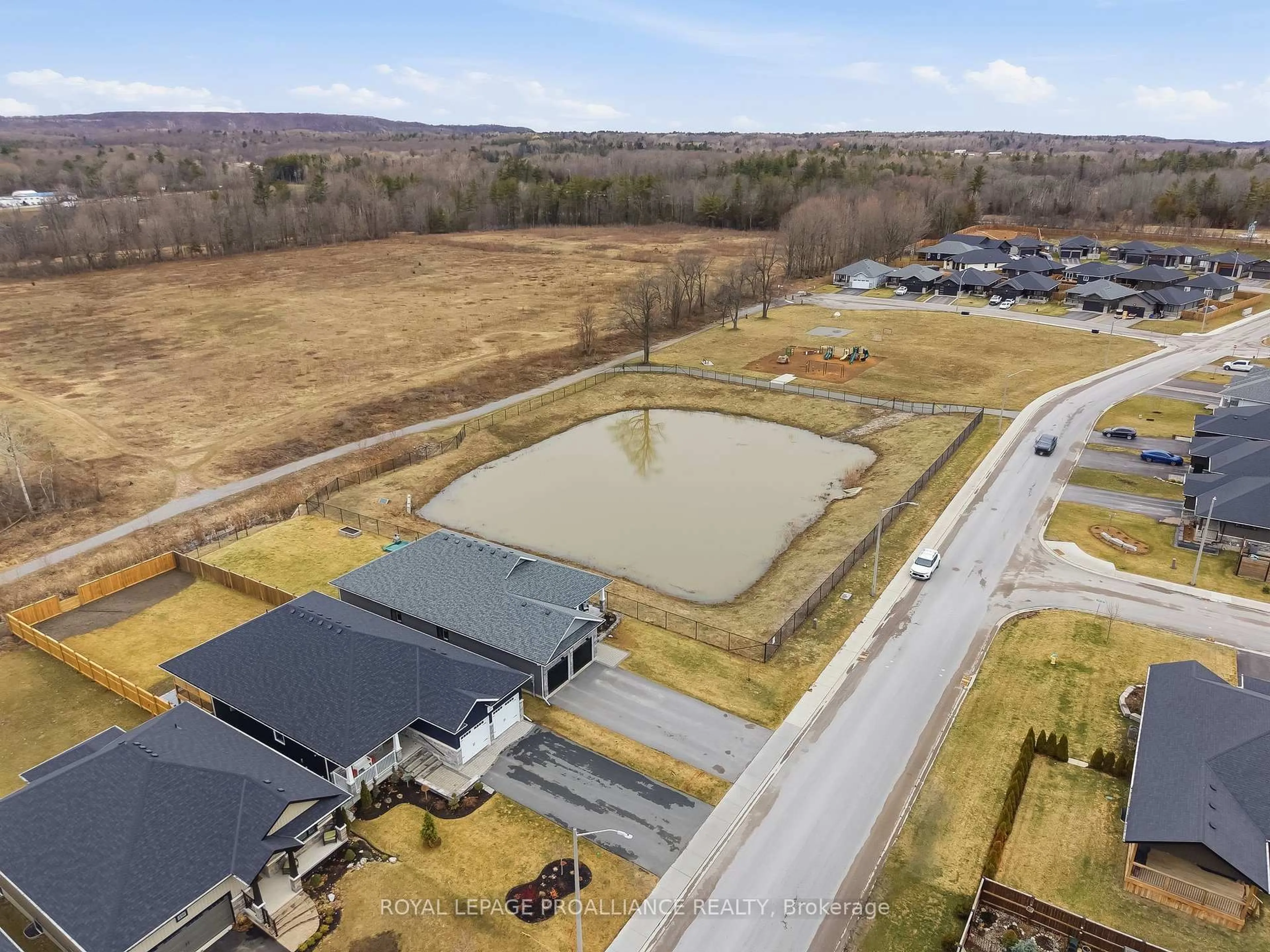 A pic from outside/outdoor area/front of a property/back of a property/a pic from drone, water/lake/river/ocean view for 15 Ambrosia Terr, Quinte West Ontario K8V 0G7