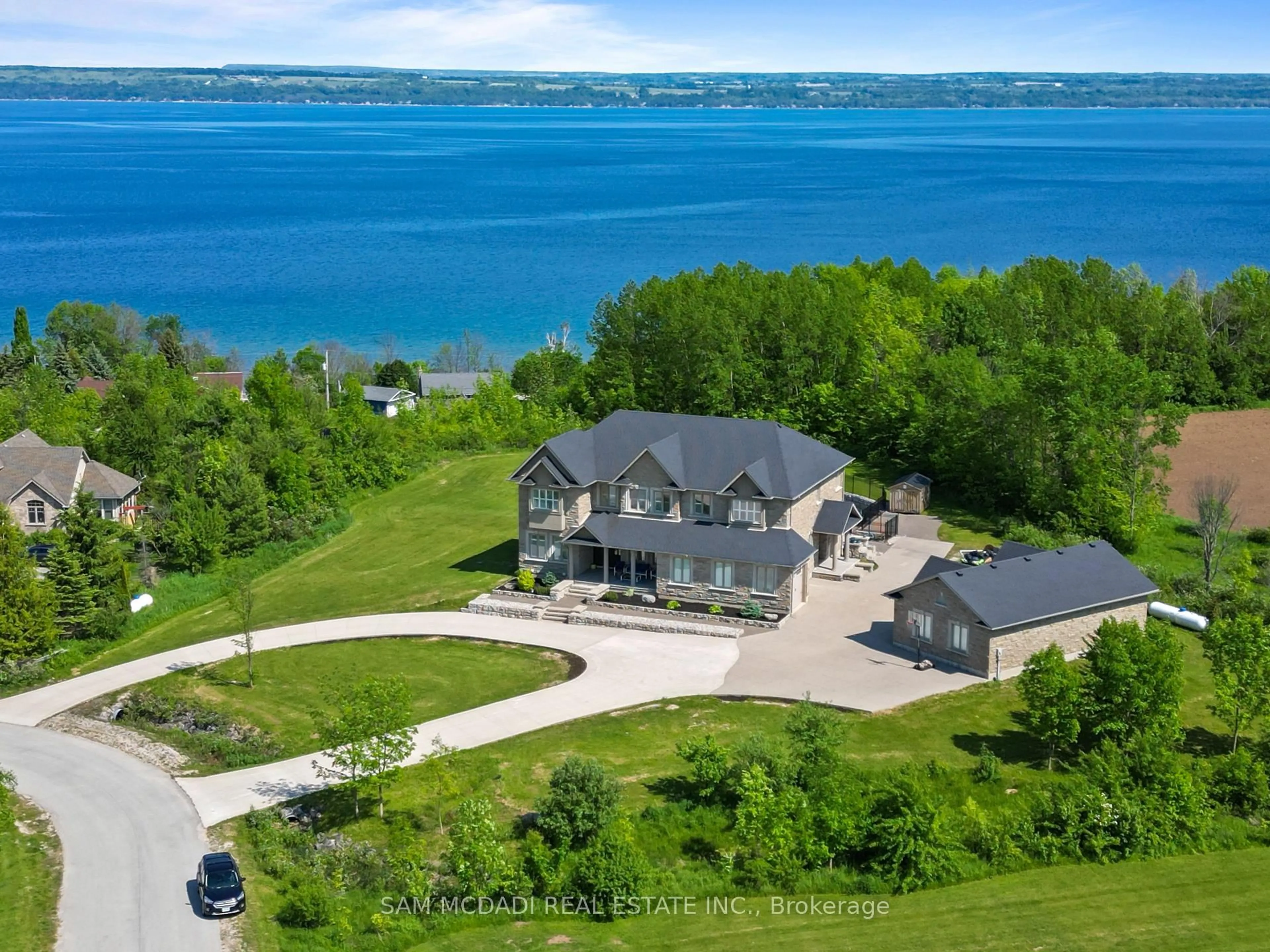 A pic from outside/outdoor area/front of a property/back of a property/a pic from drone, water/lake/river/ocean view for 119 Ishwar Dr, Georgian Bluffs Ontario N0H 1S0