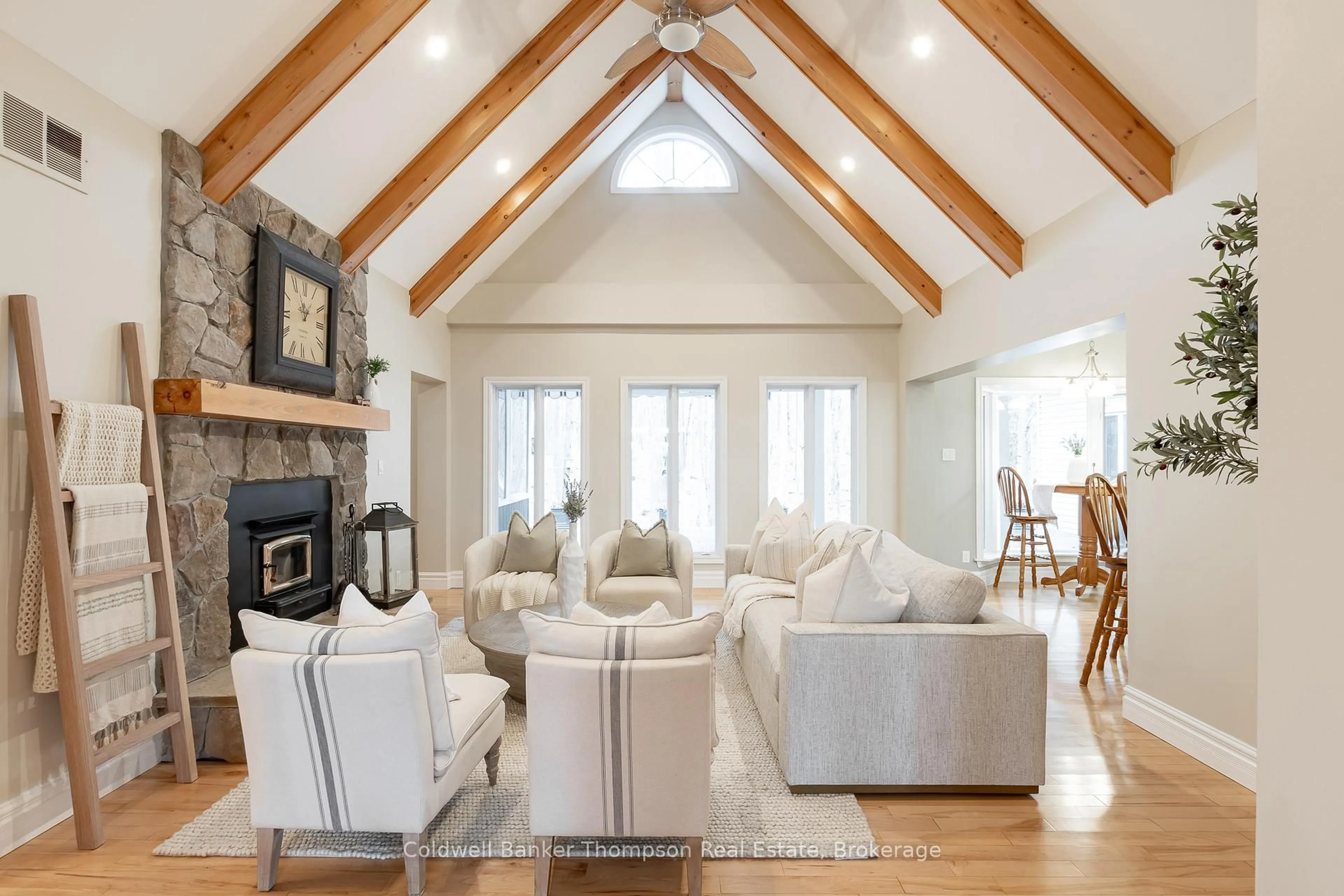 Living room with furniture, wood/laminate floor for 1259 Golf Course Rd, Lake of Bays Ontario P1H 2J6