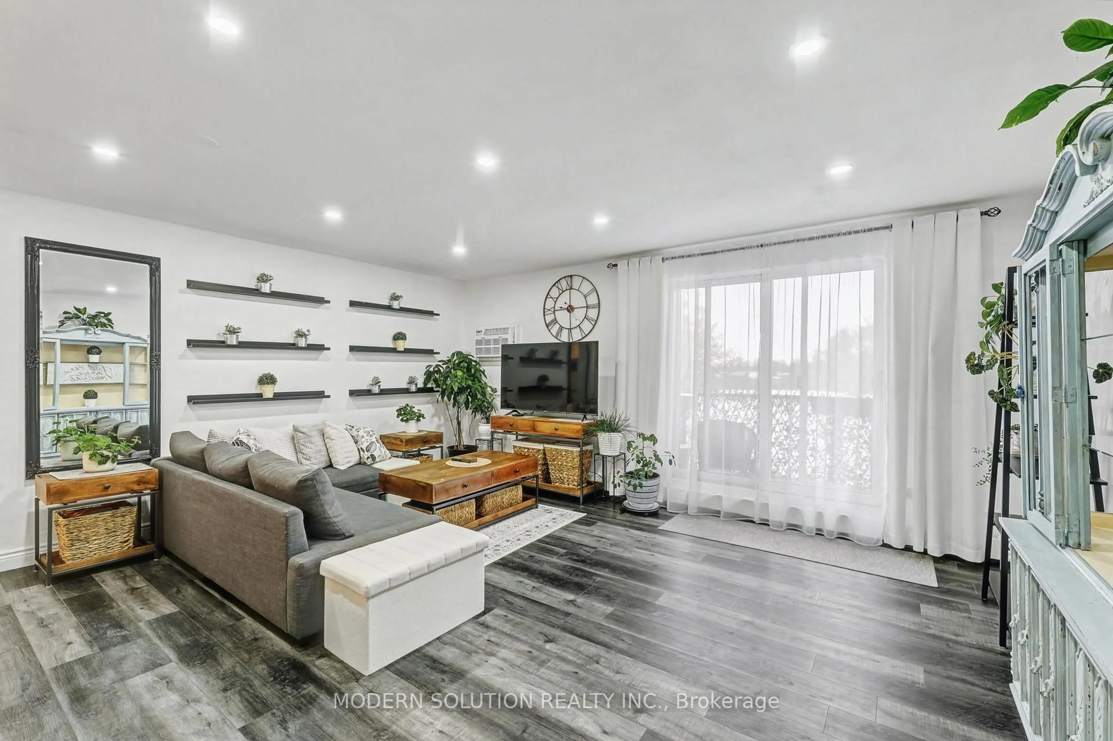 Living room with furniture, wood/laminate floor for 563 Mornington Ave #308, London East Ontario N5Y 4T8