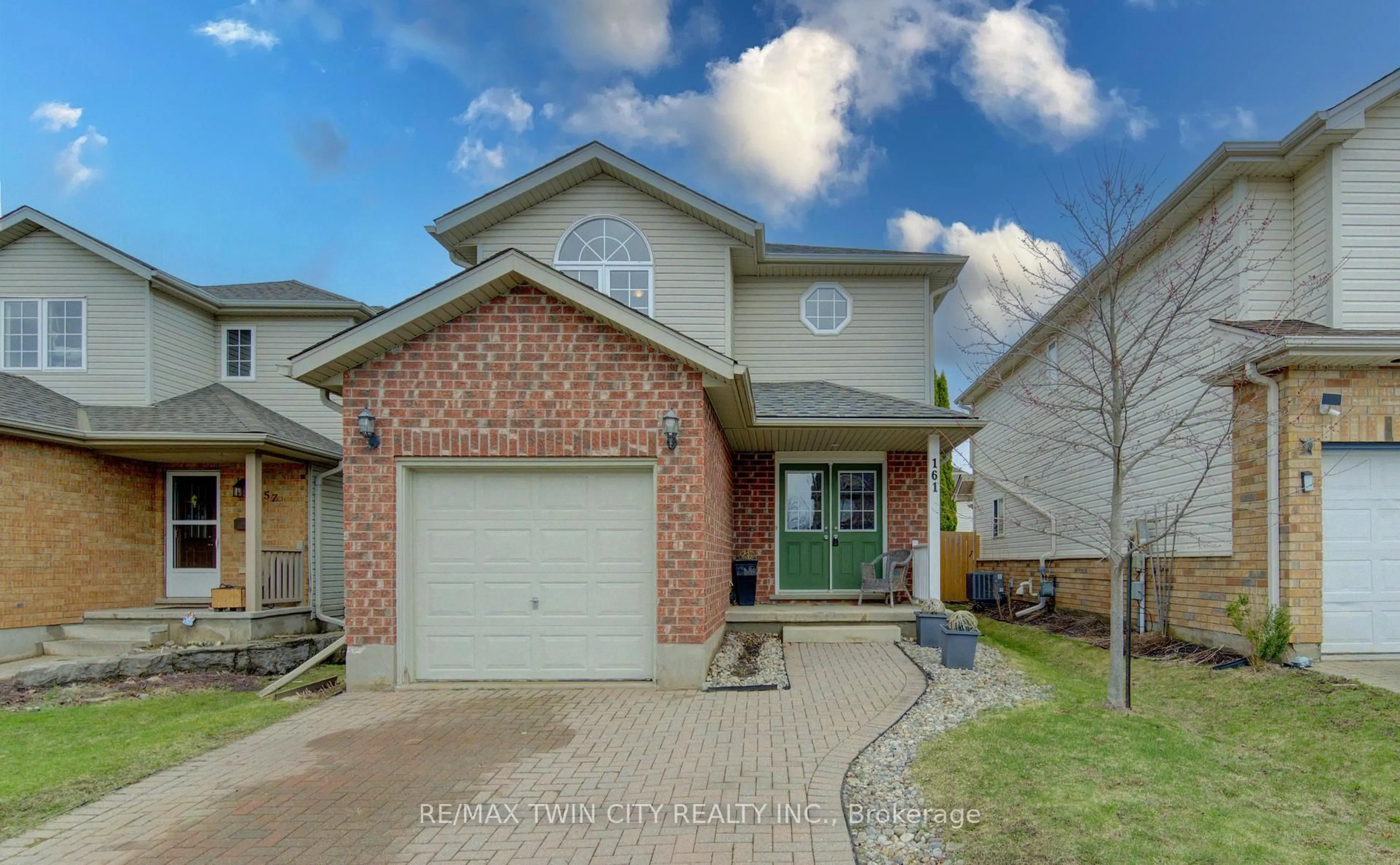 Home with brick exterior material, street for 161 Windflower Dr, Kitchener Ontario N2E 3S9