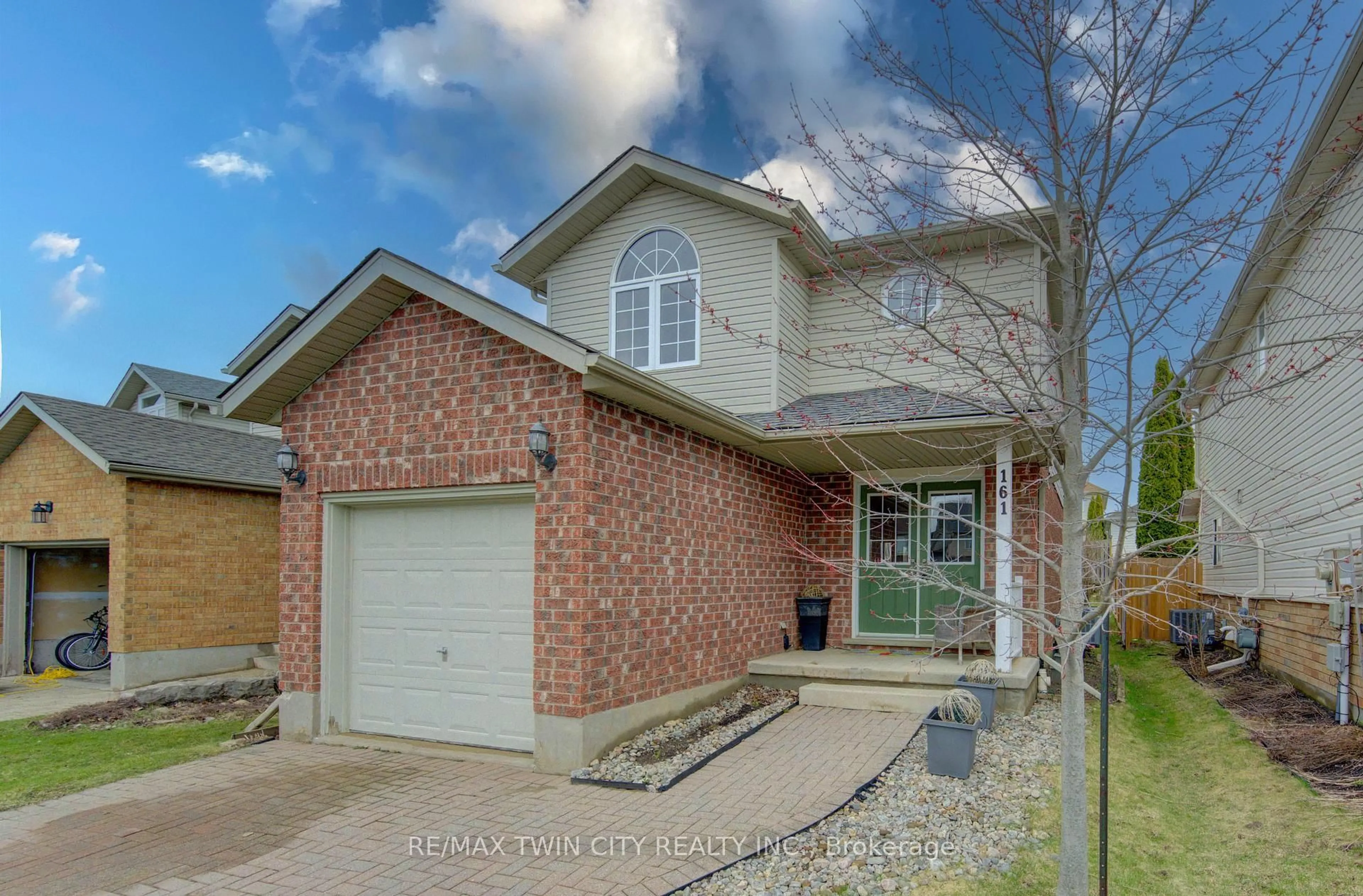 Home with brick exterior material, street for 161 Windflower Dr, Kitchener Ontario N2E 3S9