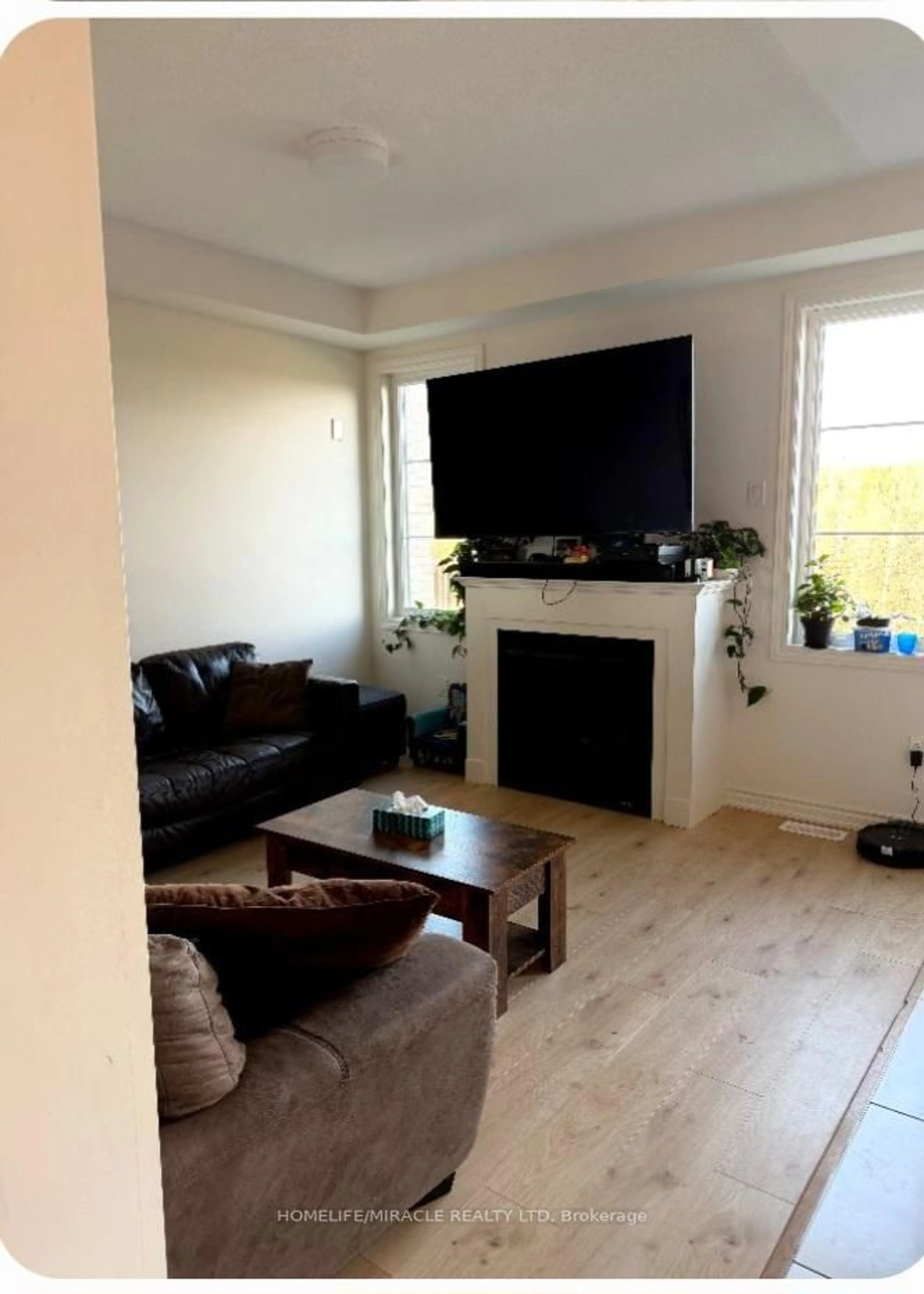 Living room with furniture, wood/laminate floor for 464 Trevor St, Cobourg Ontario K9A 4J8