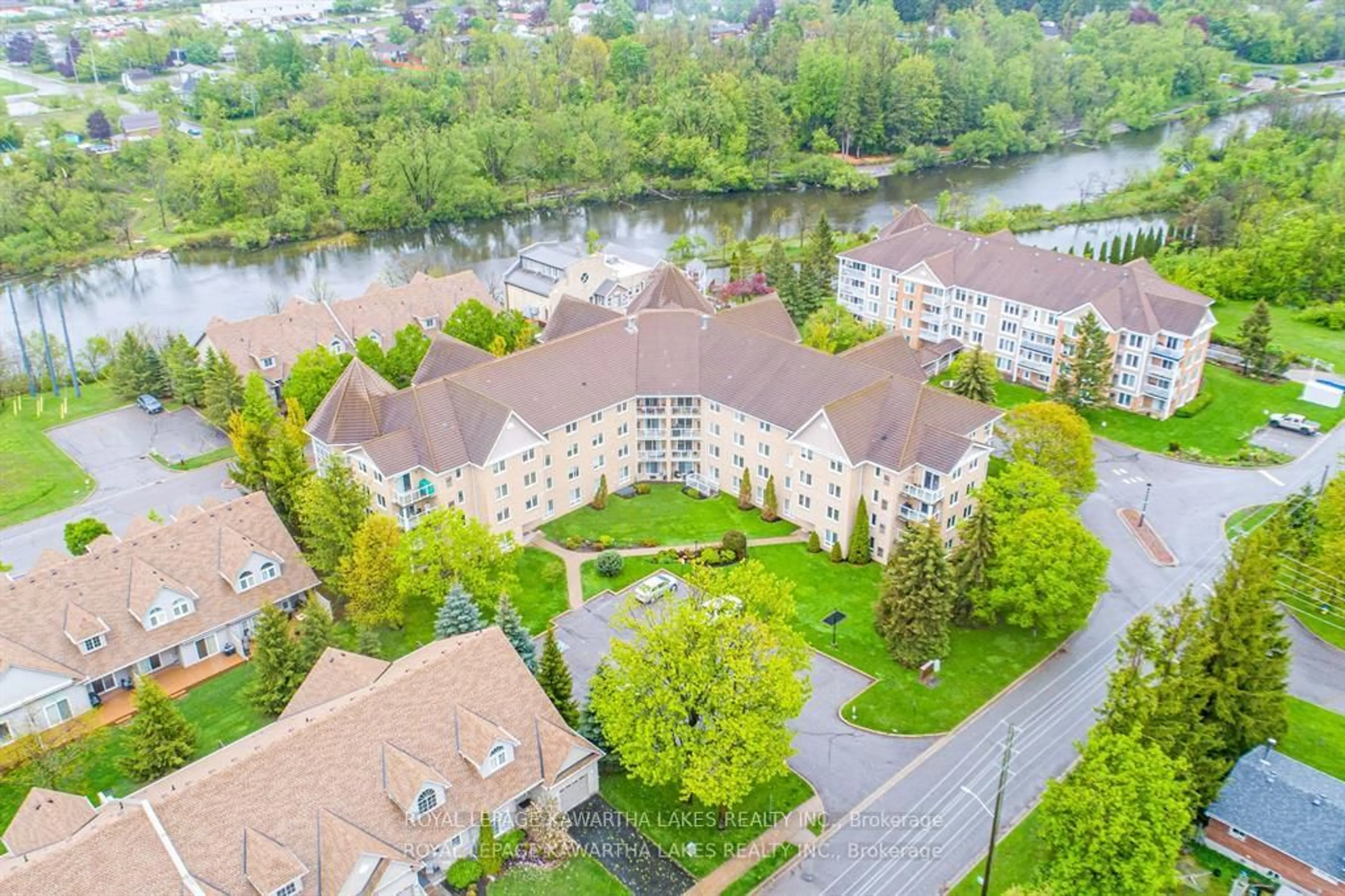 A pic from outside/outdoor area/front of a property/back of a property/a pic from drone, water/lake/river/ocean view for 51 Rivermill Blvd #404, Kawartha Lakes Ontario K9V 6E8