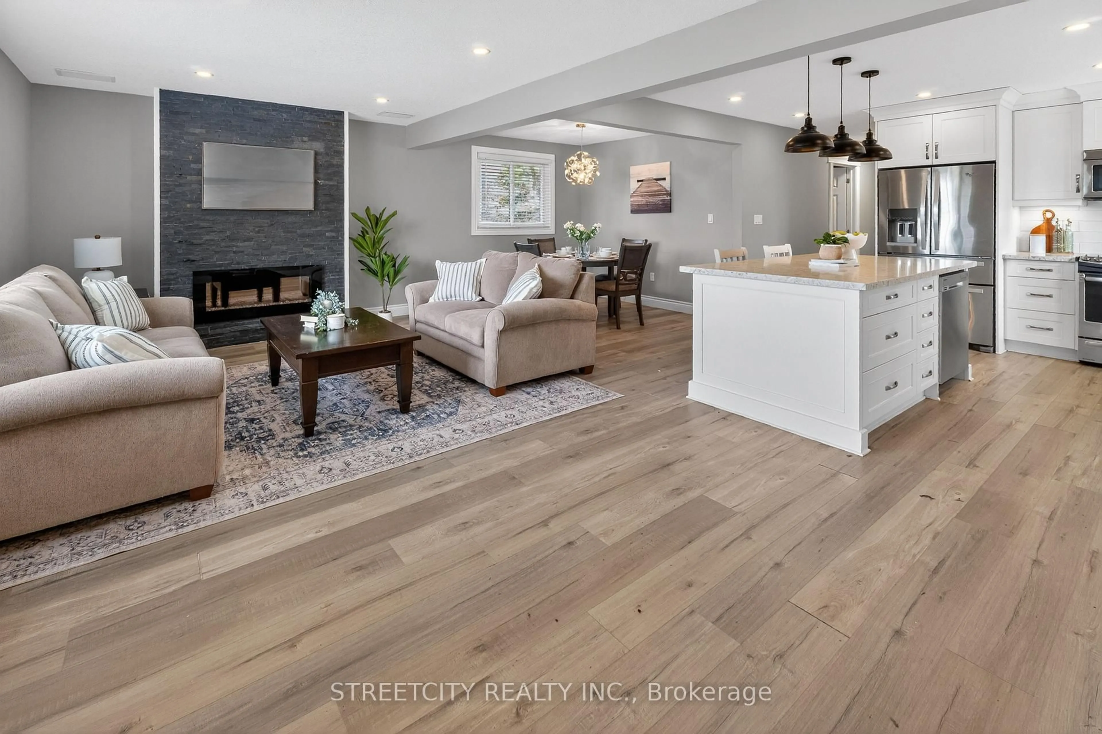 Open concept kitchen, wood/laminate floor for 3 Brinkman Crt, St. Thomas Ontario N5P 2G6