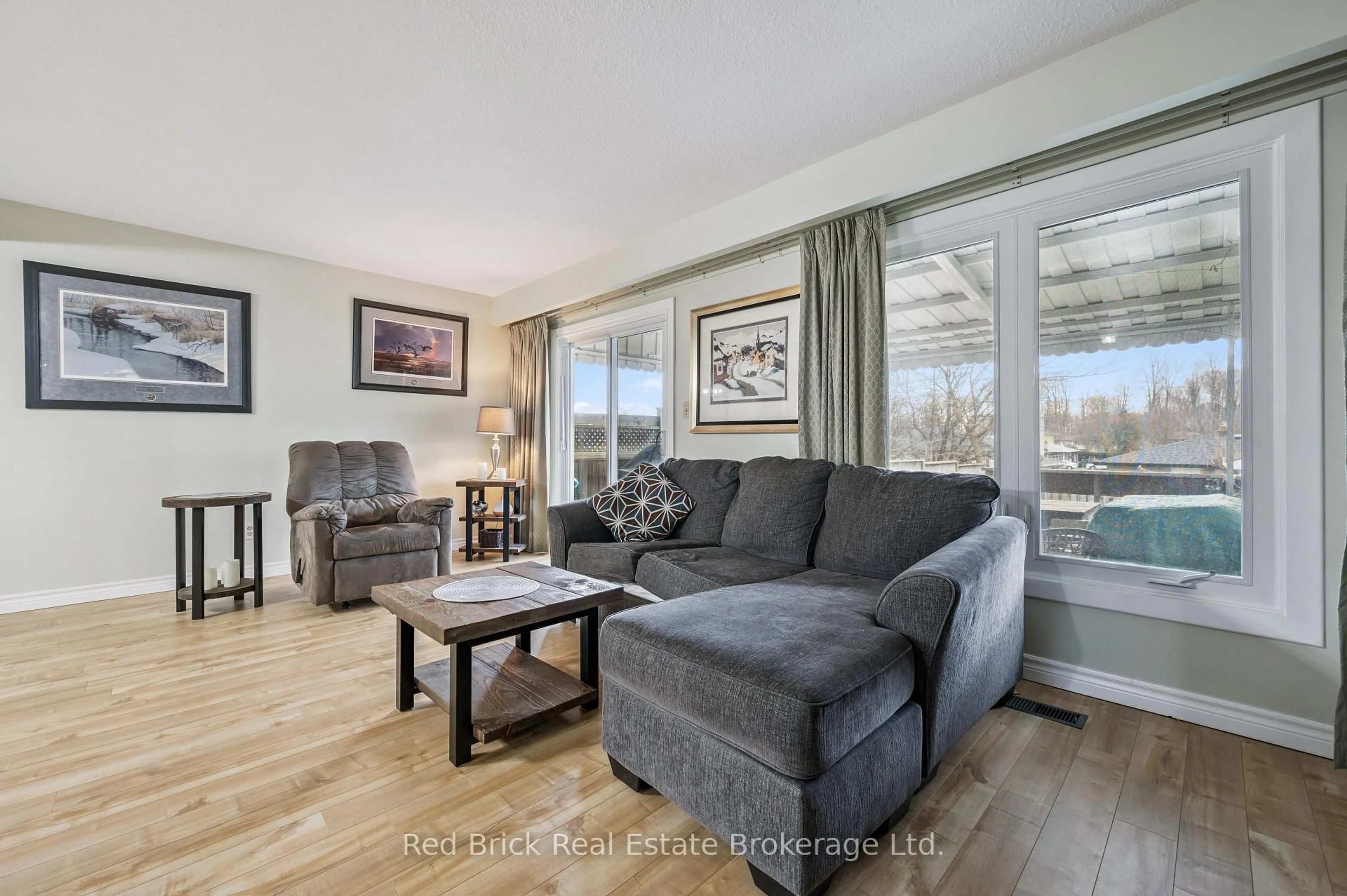 Living room with furniture, wood/laminate floor for 53 Shadeland Cres, Kitchener Ontario N2M 2J1