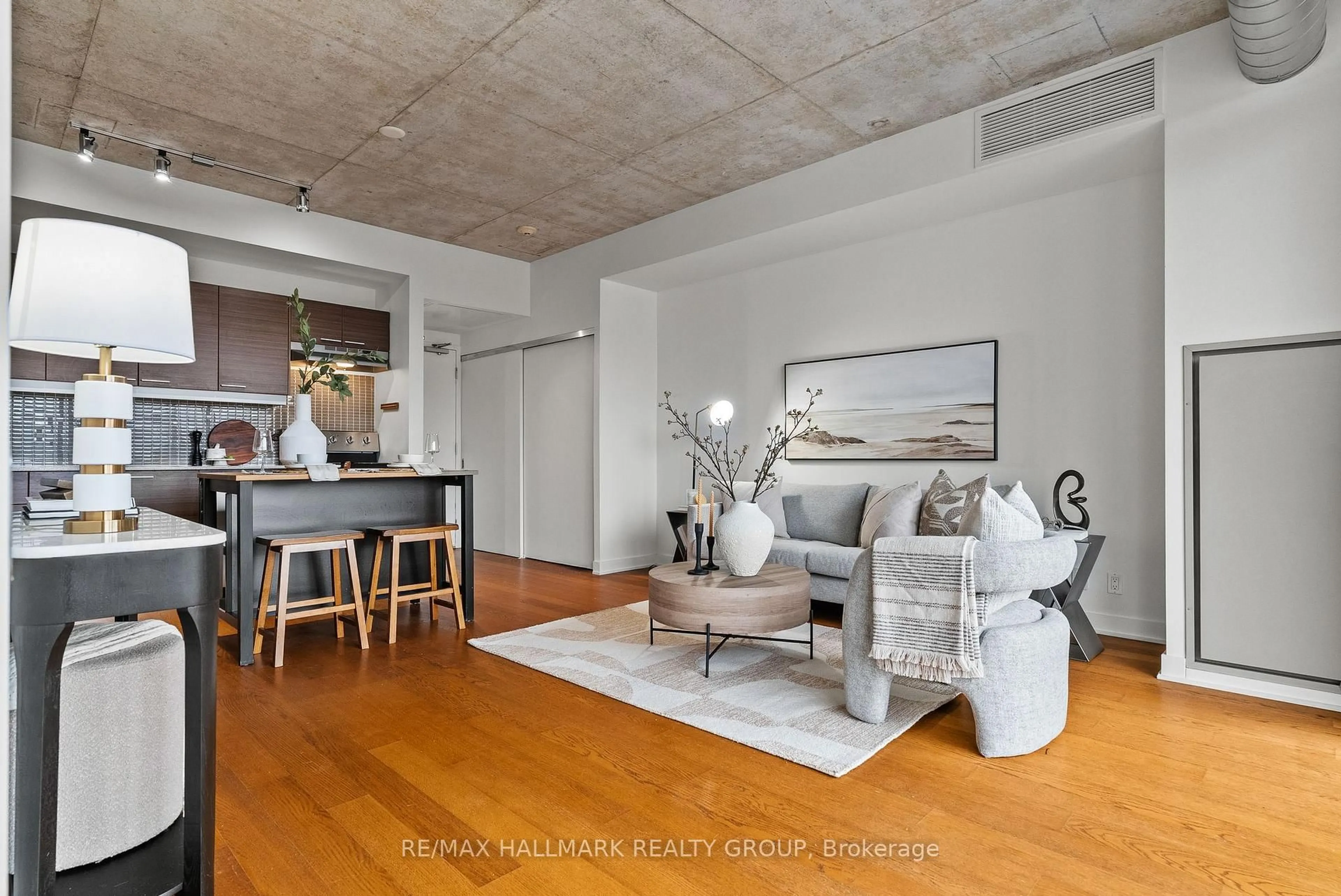 Living room with furniture, cement floor for 354 Gladstone Ave #332, Ottawa Ontario K2P 0R4