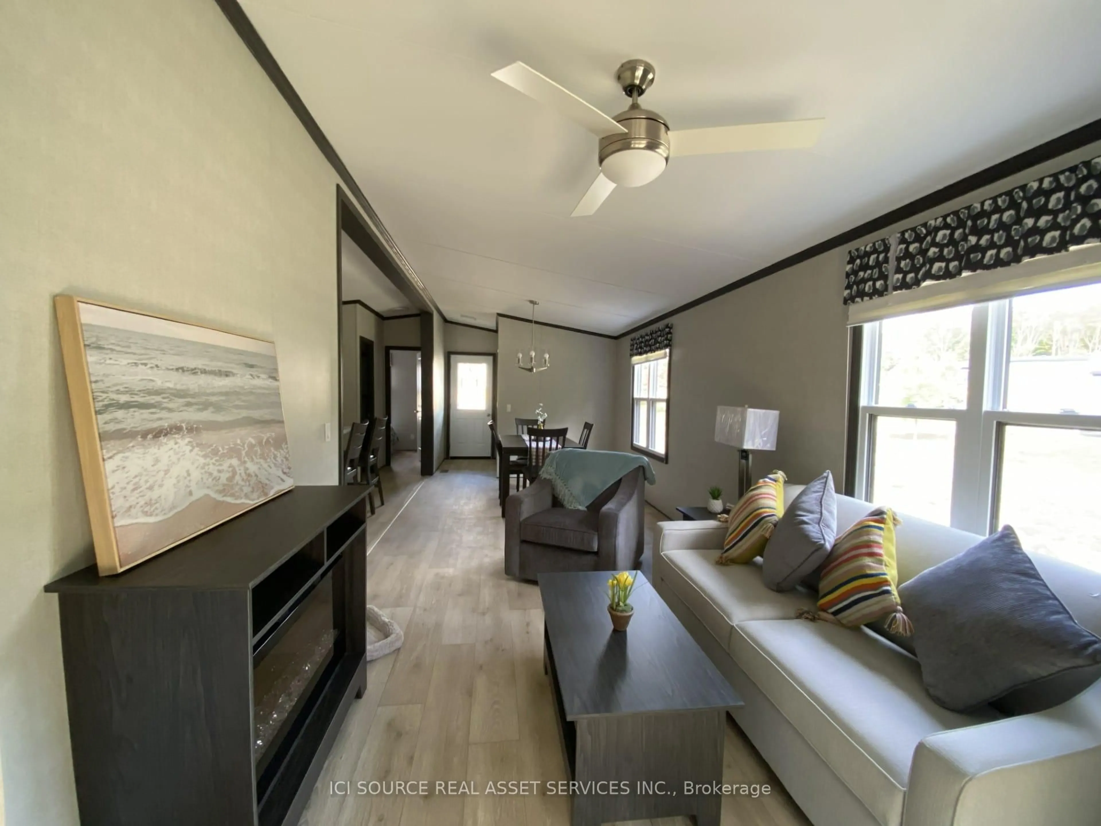 Living room with furniture, wood/laminate floor for 1047 Bonnie Lake Camp Rd #LKR059, Bracebridge Ontario P1L 1W9