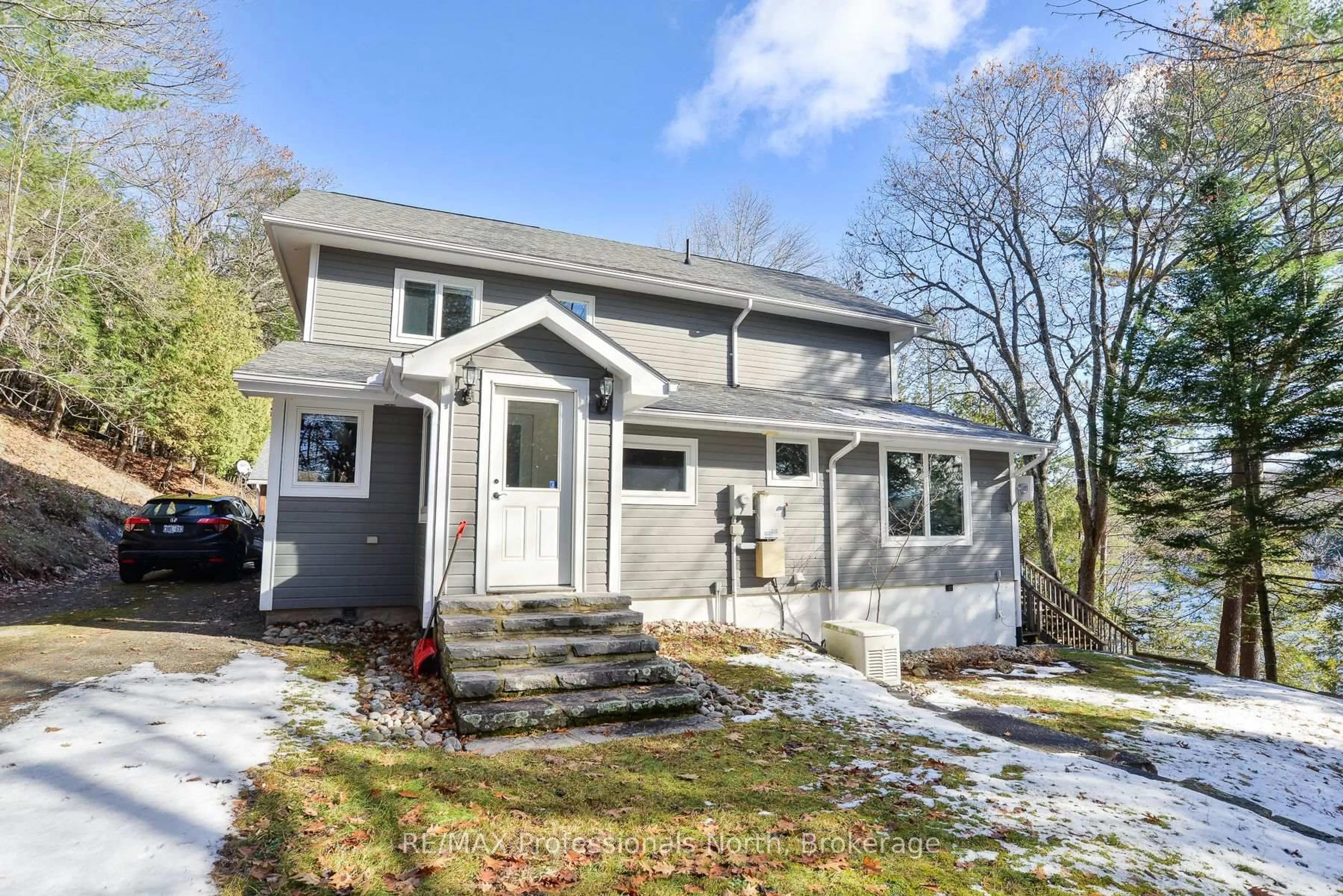 Home with vinyl exterior material, street for 1009-2 Arts Rd, Lake of Bays Ontario P0A 1H0