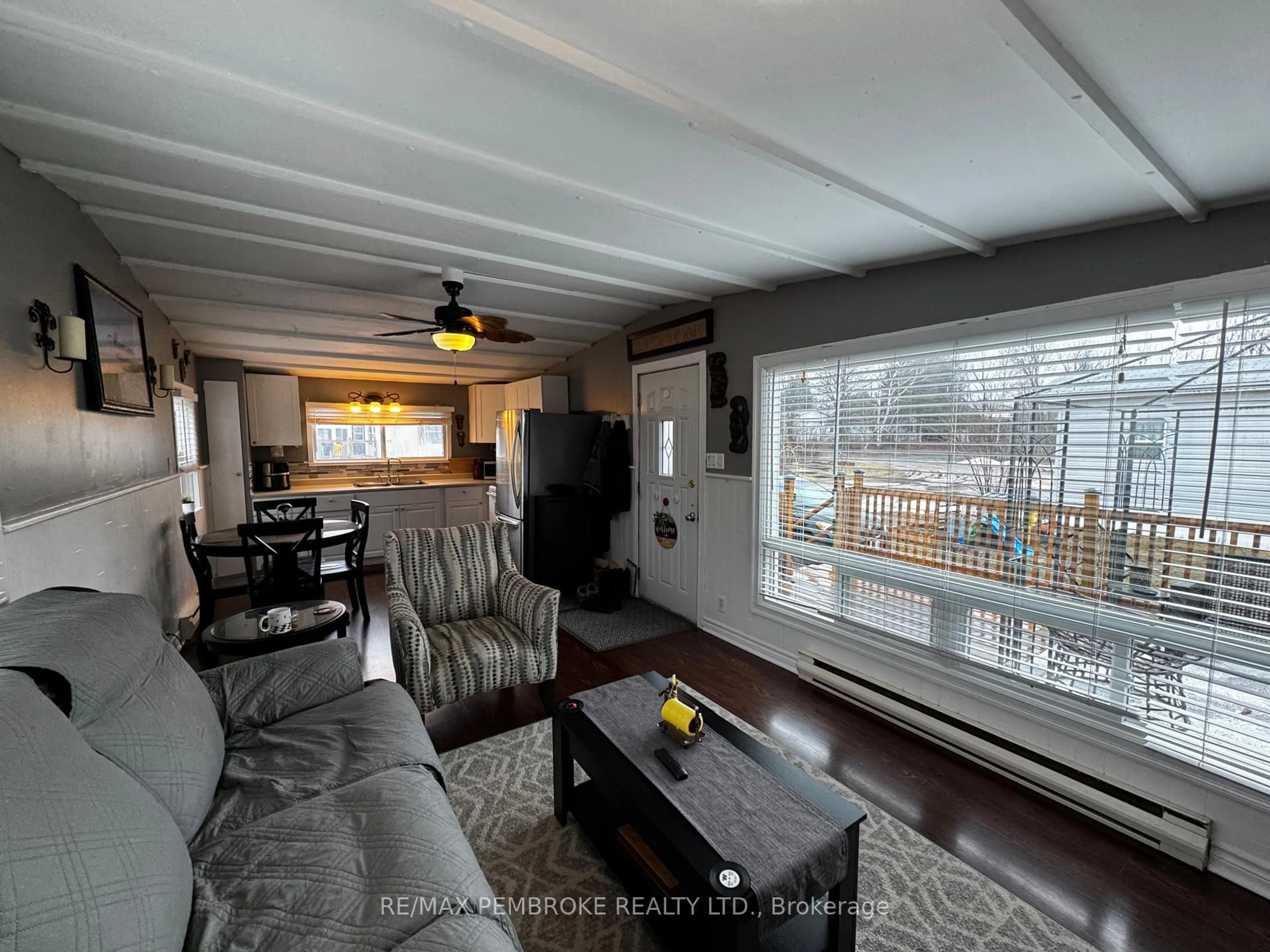 Living room with furniture, wood/laminate floor for 72 Pinehurst Estates, Petawawa Ontario K8H 2H2