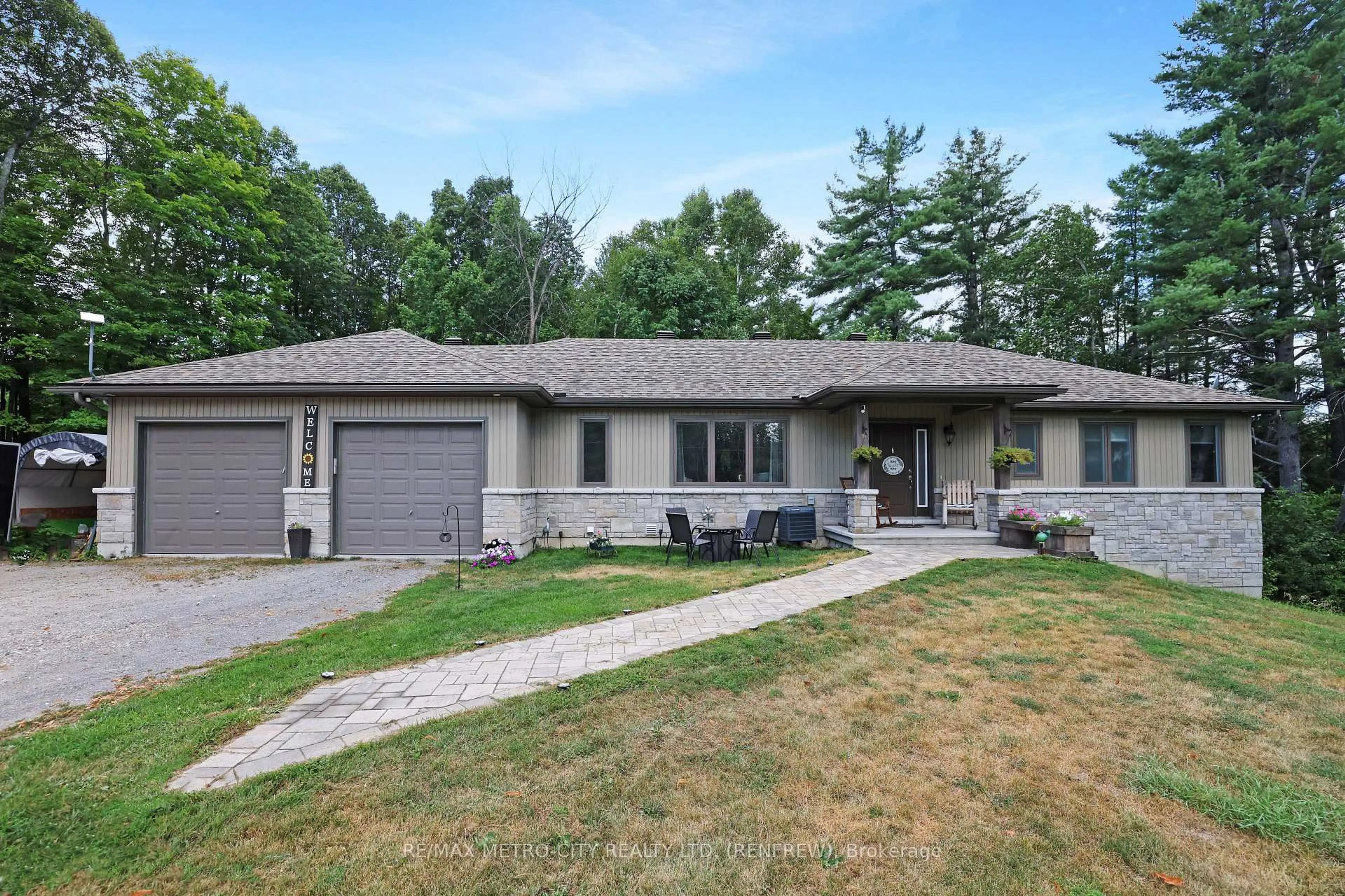 Home with vinyl exterior material, street for 2457 Burnstown Rd, Renfrew Ontario K7V 3Z4