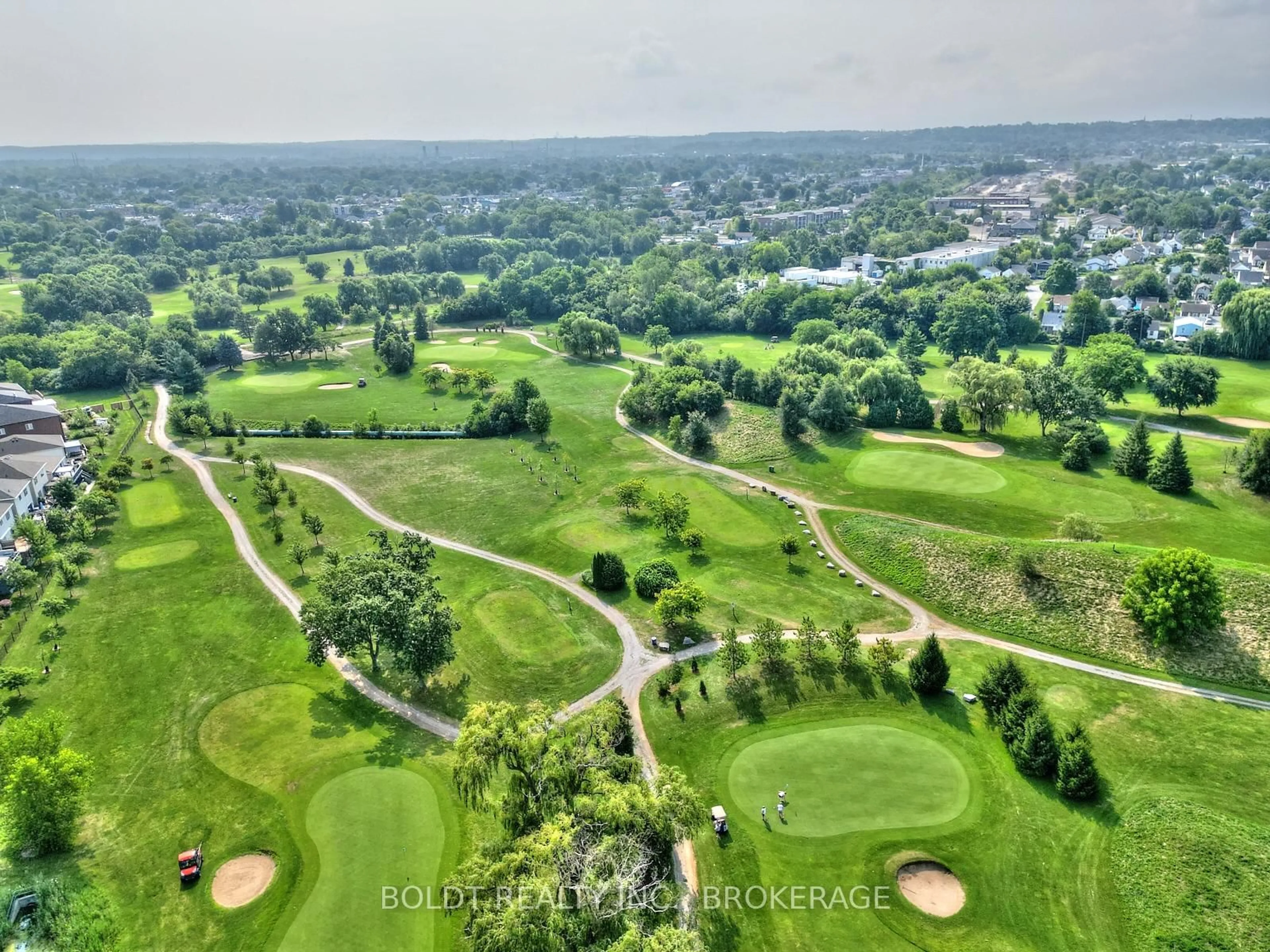 A pic from outside/outdoor area/front of a property/back of a property/a pic from drone, forest/trees view for 50 Herrick Ave #GL 11, St. Catharines Ontario L2P 0G3