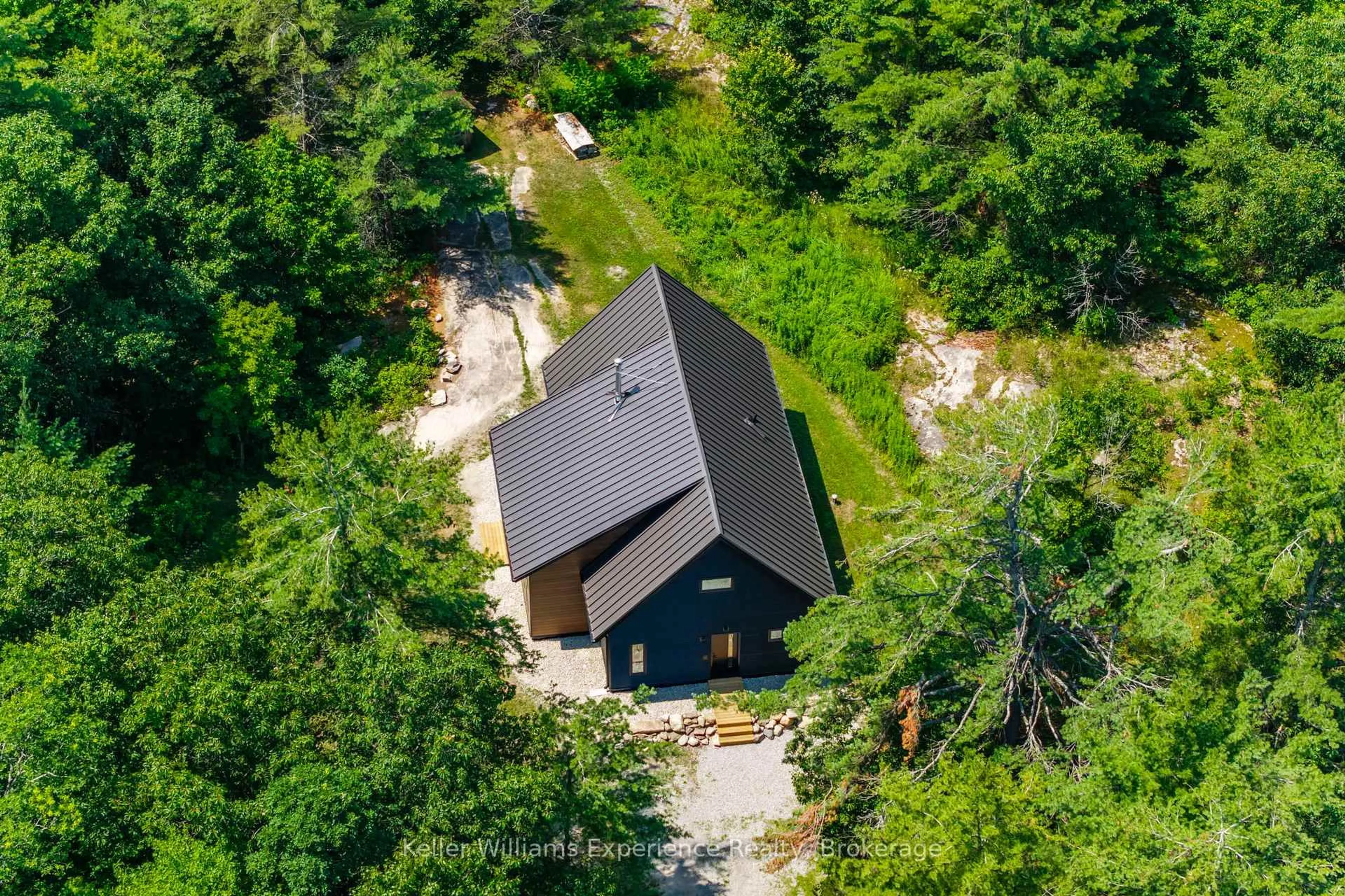A pic from outside/outdoor area/front of a property/back of a property/a pic from drone, forest/trees view for 753 Honey Harbour Rd, Georgian Bay Ontario L0K 1S0