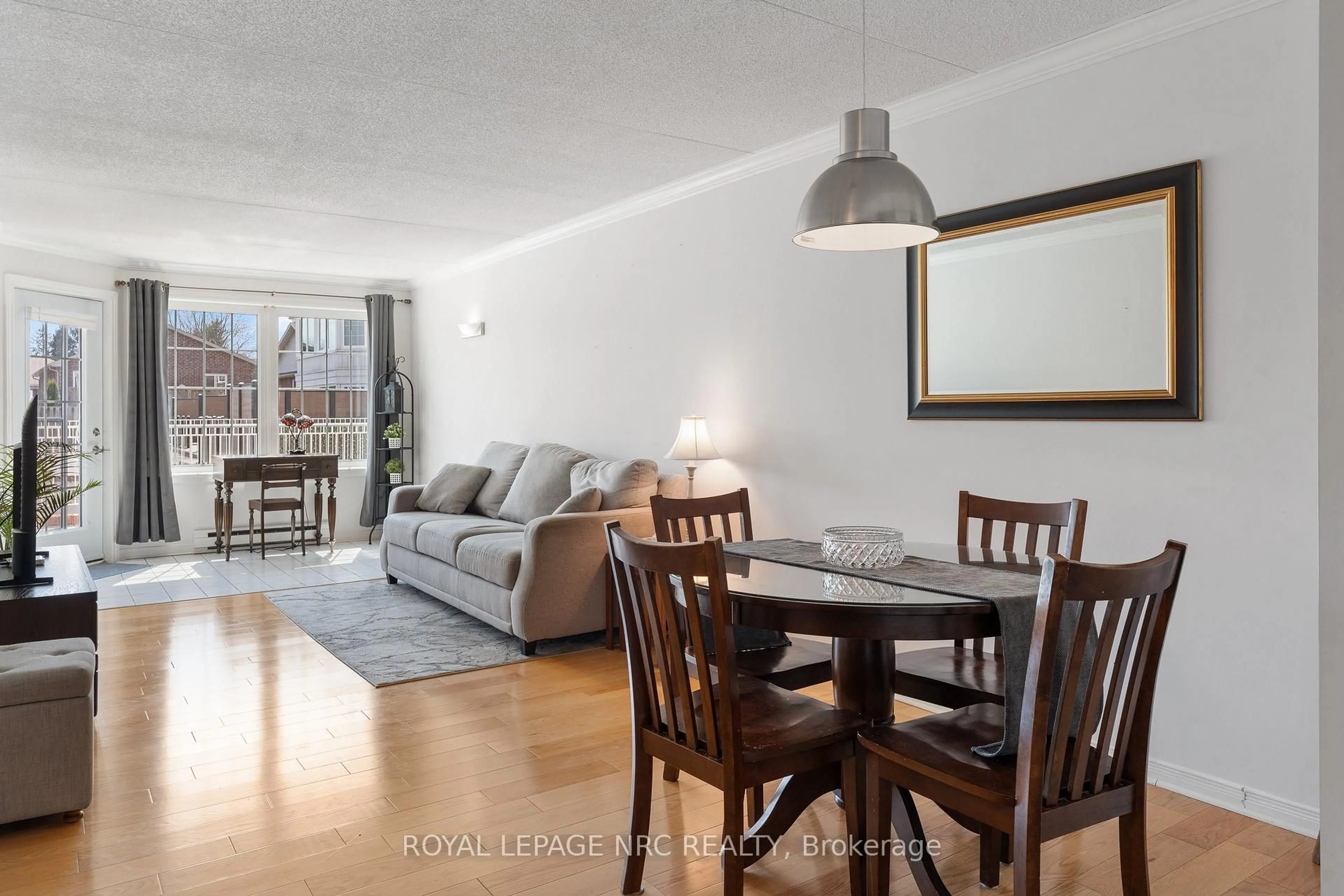 Living room with furniture, wood/laminate floor for 3420 Frederick Ave #115, Lincoln Ontario L0R 2C0