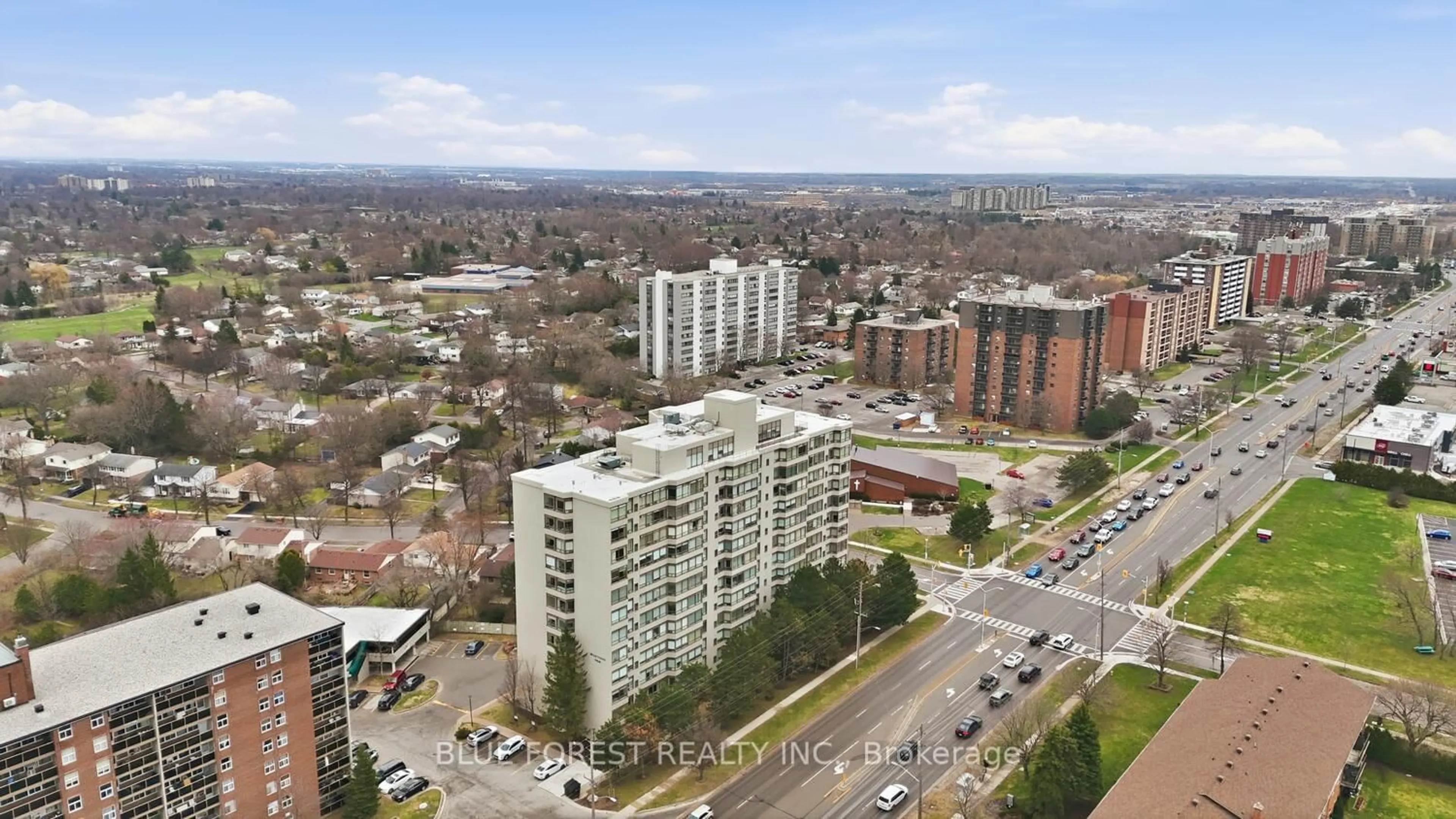 A pic from outside/outdoor area/front of a property/back of a property/a pic from drone, city buildings view from balcony for 744 Wonderland Rd #203, London South Ontario N6K 4K3