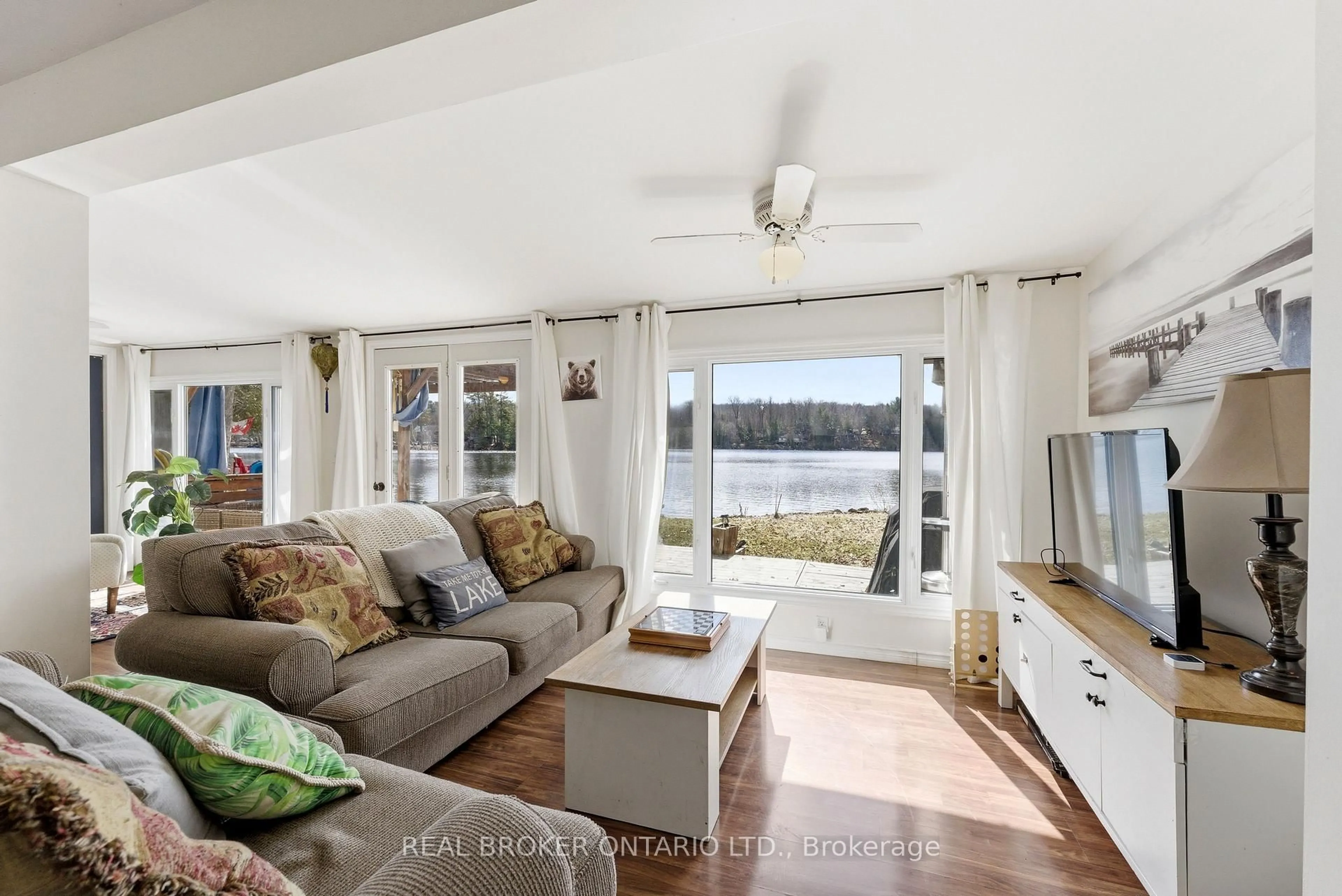 Living room with furniture, wood/laminate floor for 573 Pine Point Lane, Tweed Ontario K0K 3J0