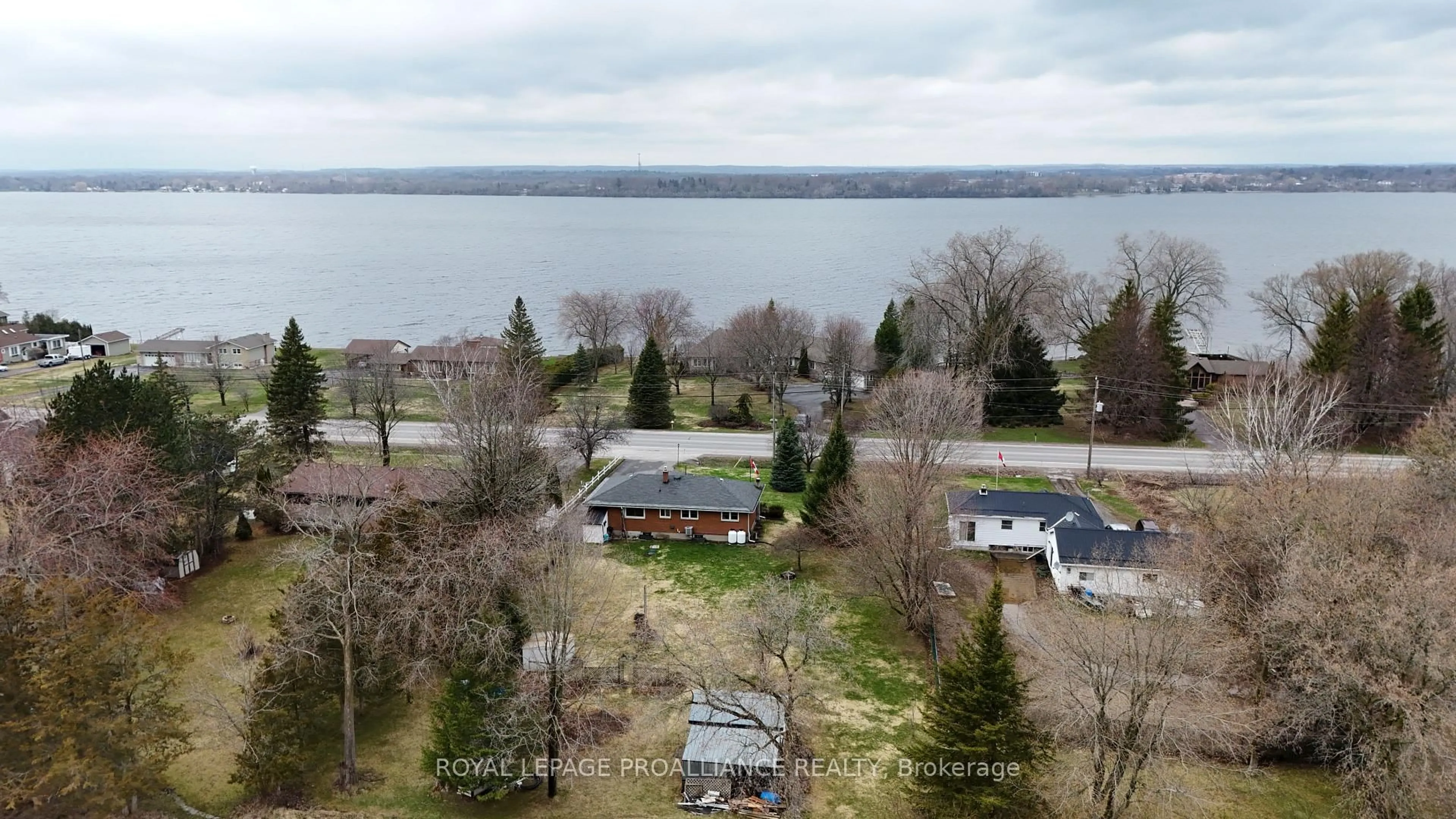 A pic from outside/outdoor area/front of a property/back of a property/a pic from drone, water/lake/river/ocean view for 471 County Road 3, Prince Edward County Ontario K8N 4Z1