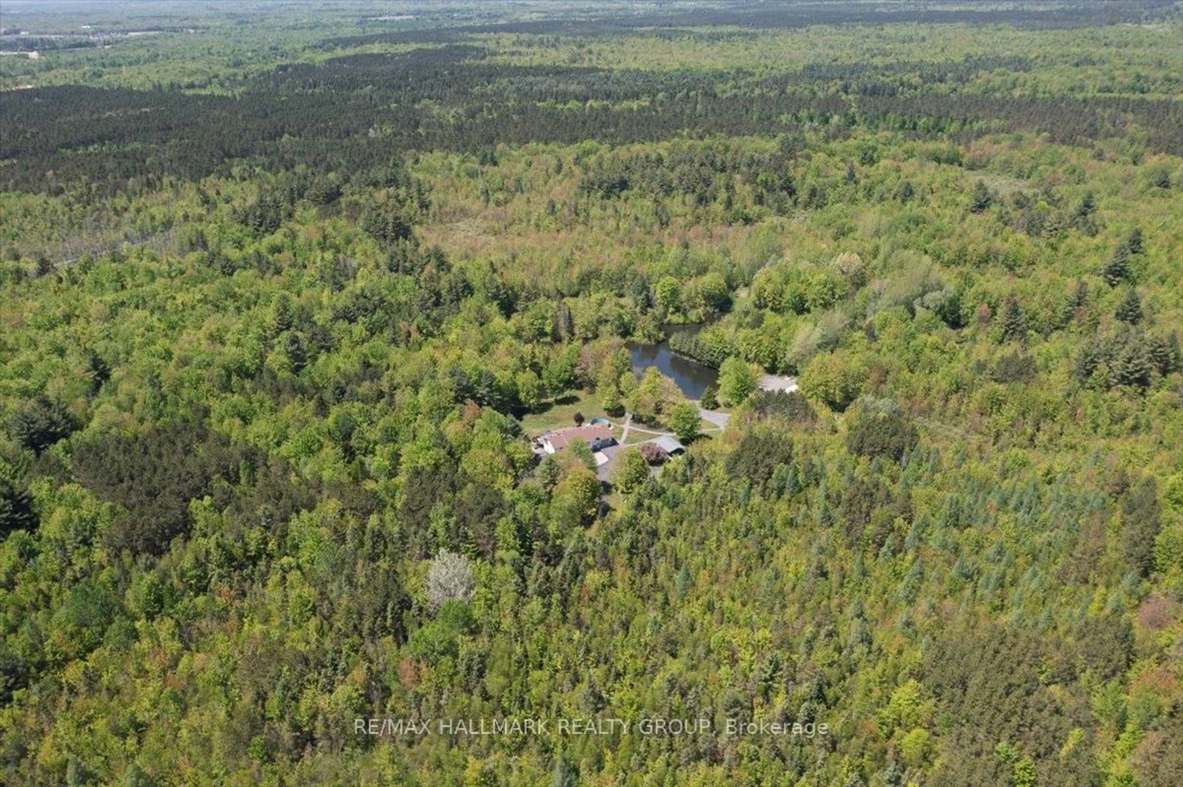 A pic from outside/outdoor area/front of a property/back of a property/a pic from drone, forest/trees view for 1720 Des Pins Rd, The Nation Ontario K0A 2M0
