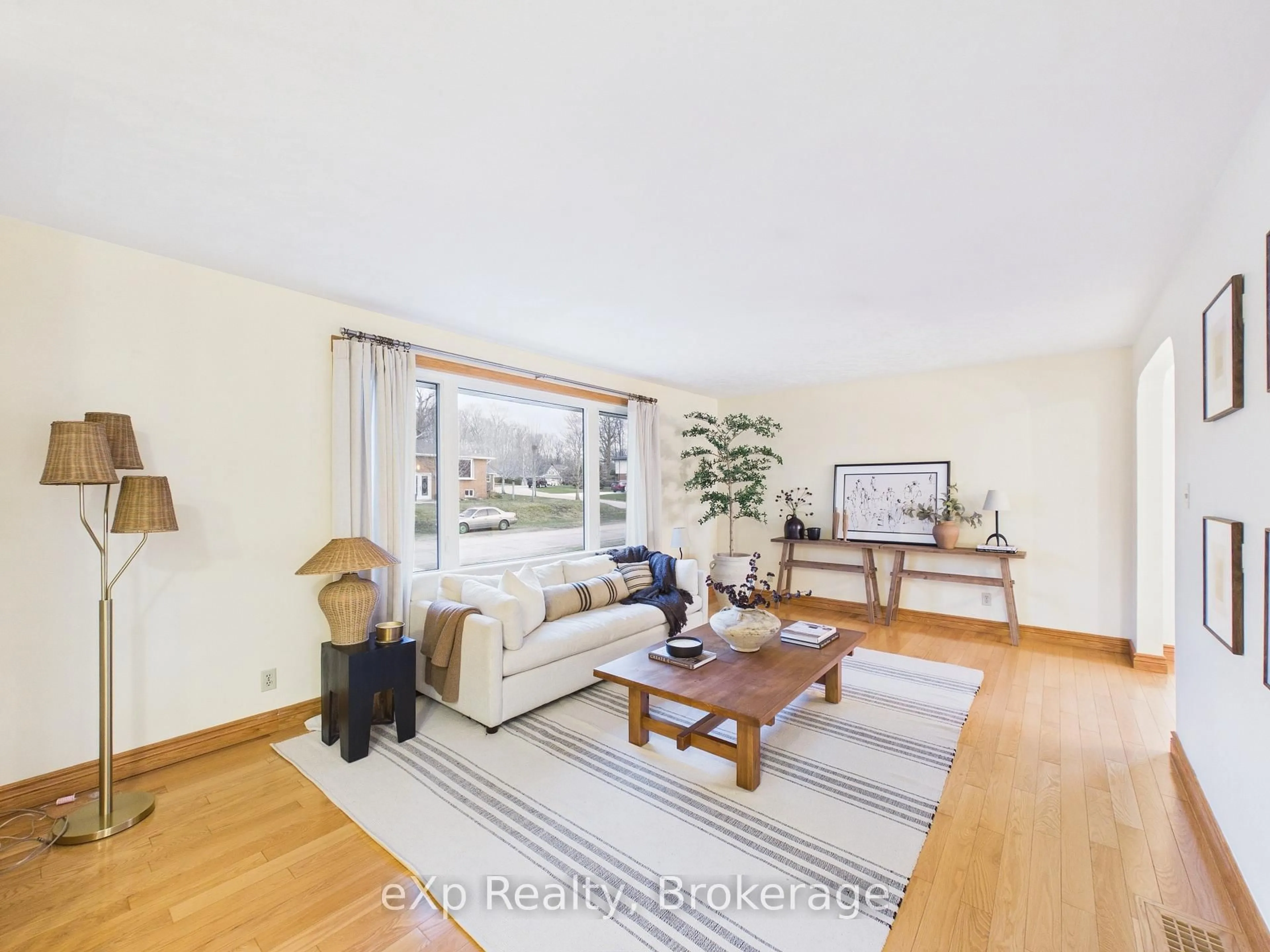 Living room with furniture, wood/laminate floor for 422 Wellington St, Saugeen Shores Ontario N0H 2C4