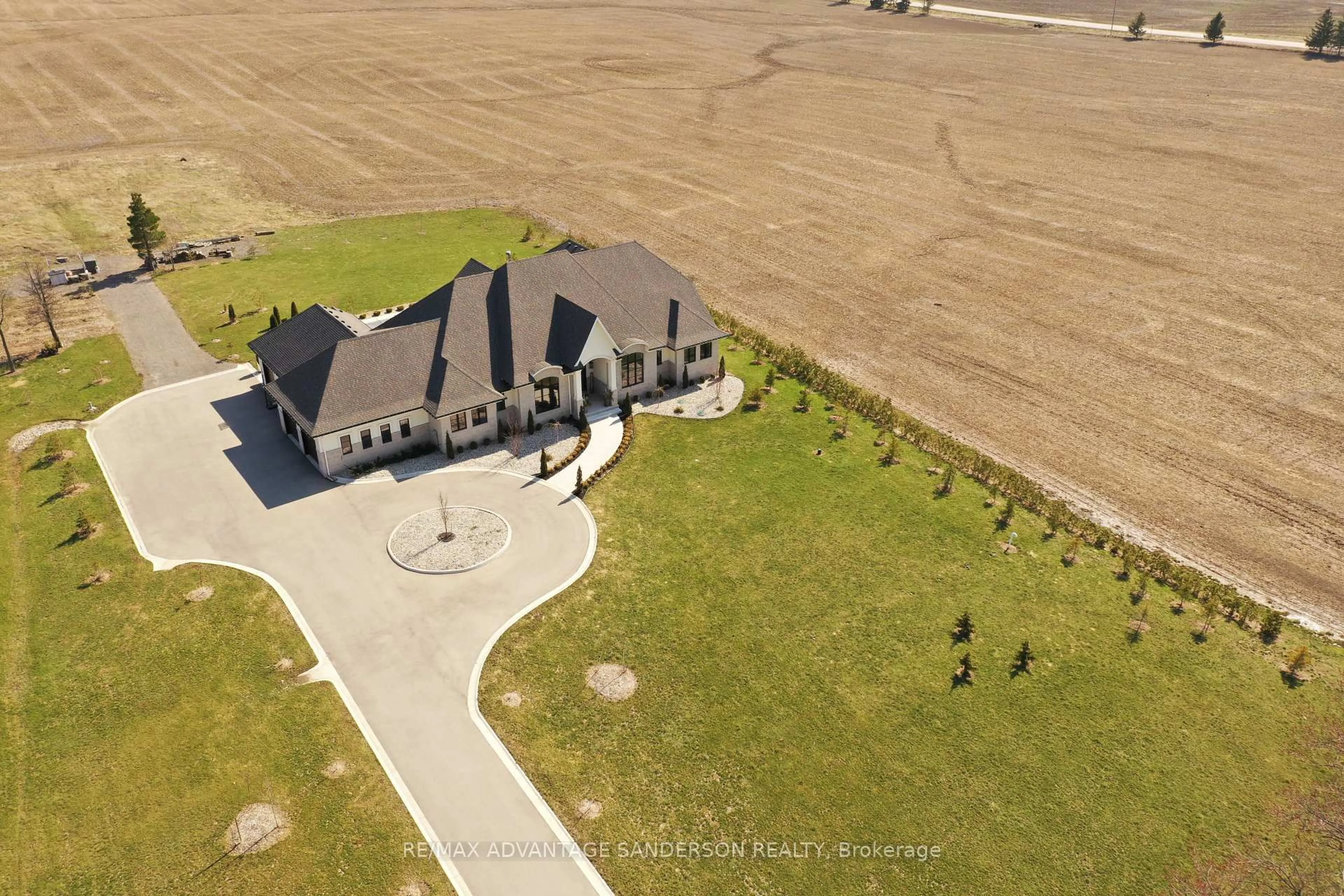 A pic from outside/outdoor area/front of a property/back of a property/a pic from drone, street for 13419 Thirteen Mile Rd, Middlesex Centre Ontario N0M 1P0