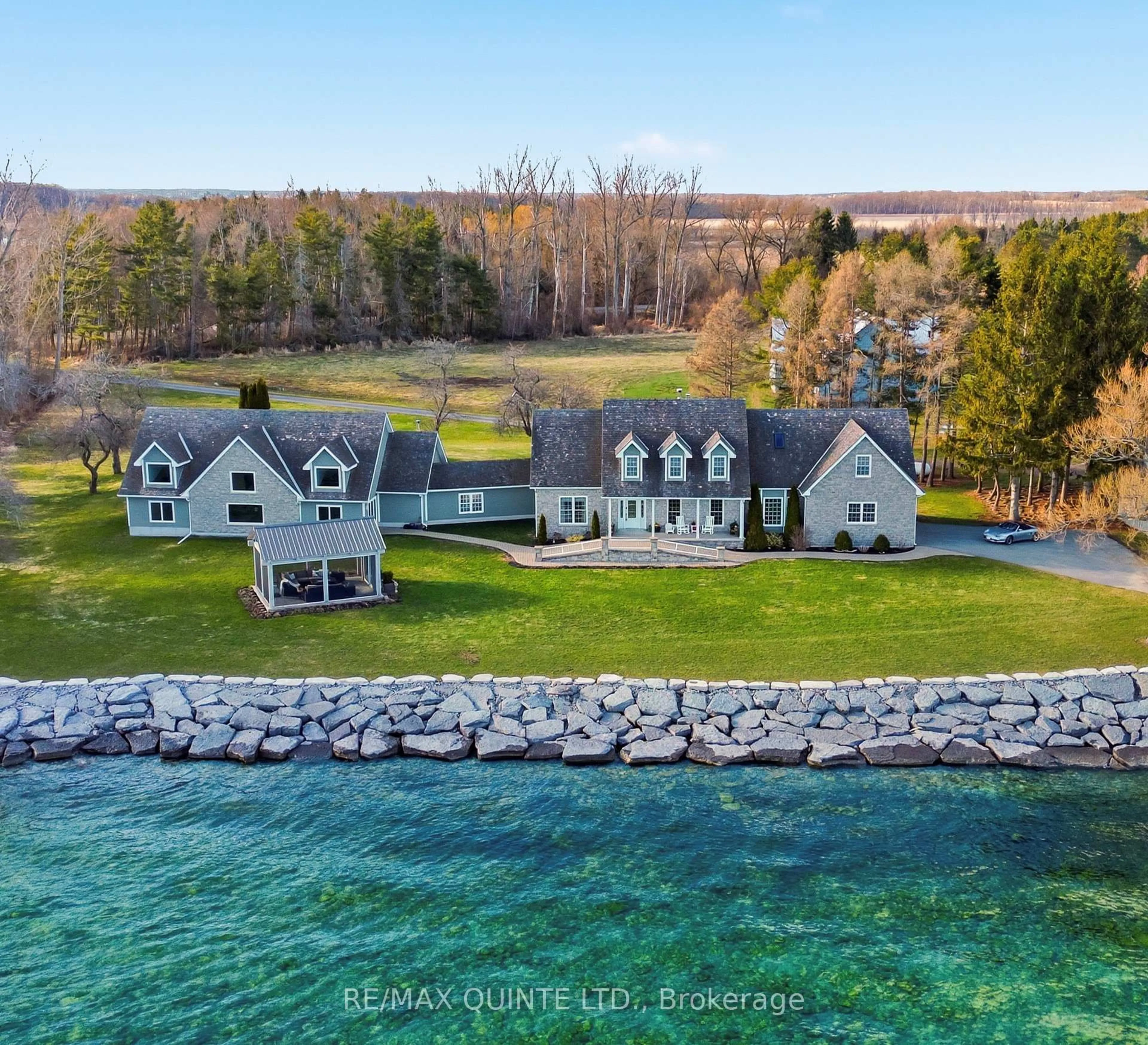 A pic from outside/outdoor area/front of a property/back of a property/a pic from drone, water/lake/river/ocean view for 4698 County Road 8, Prince Edward County Ontario K0K 2T0