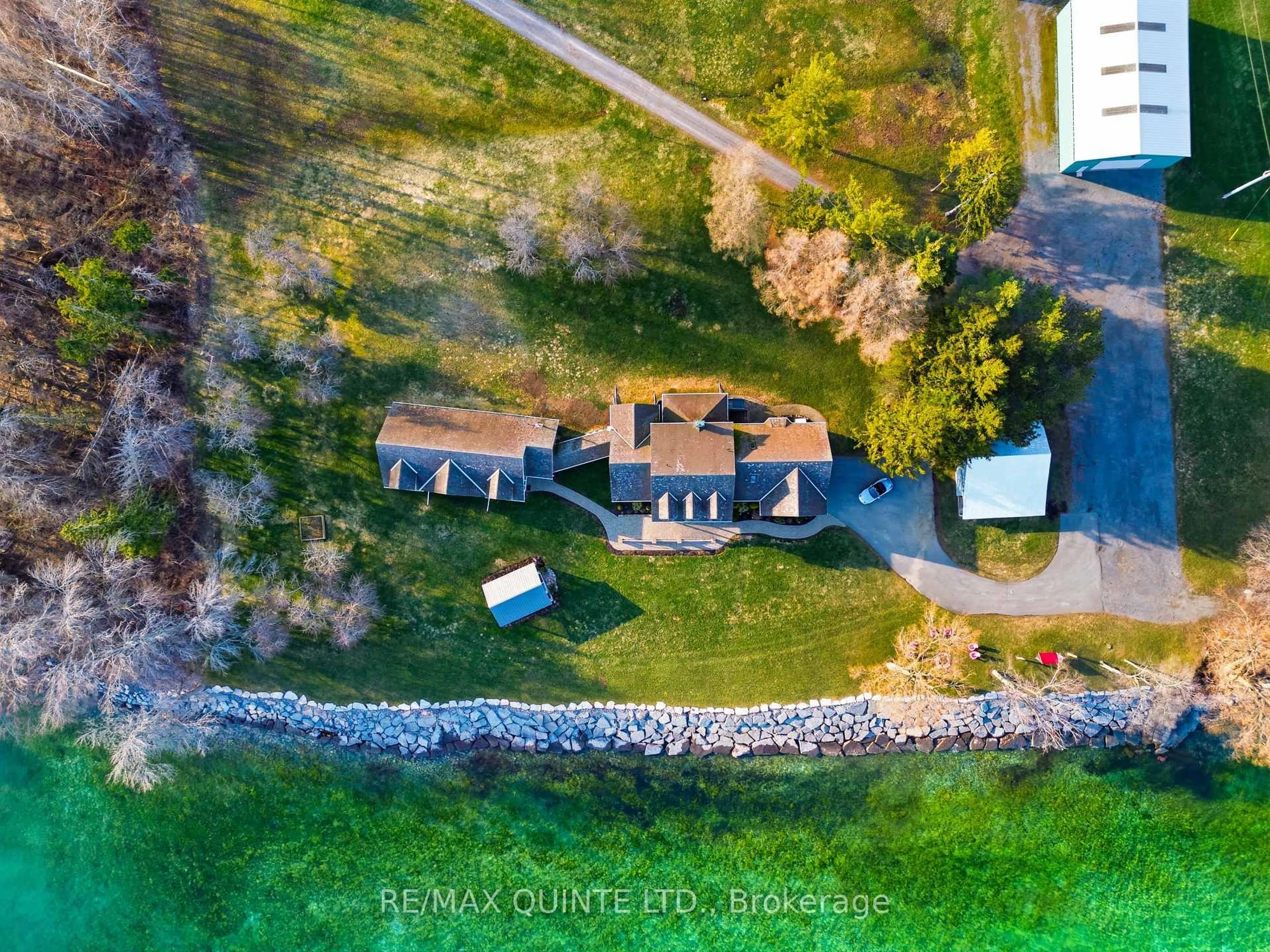 A pic from outside/outdoor area/front of a property/back of a property/a pic from drone, water/lake/river/ocean view for 4698 County Road 8, Prince Edward County Ontario K0K 2T0