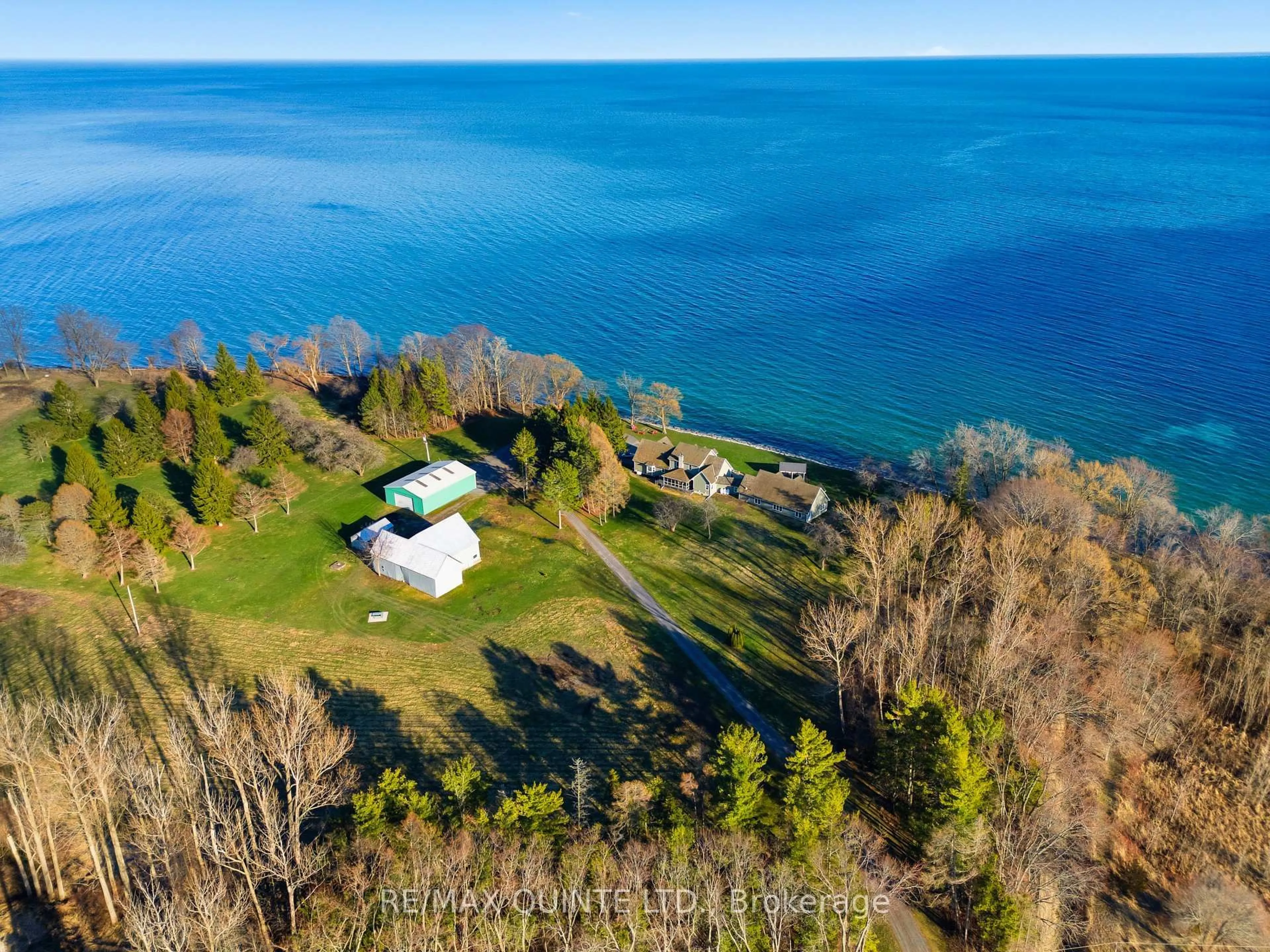 A pic from outside/outdoor area/front of a property/back of a property/a pic from drone, water/lake/river/ocean view for 4698 County Road 8, Prince Edward County Ontario K0K 2T0