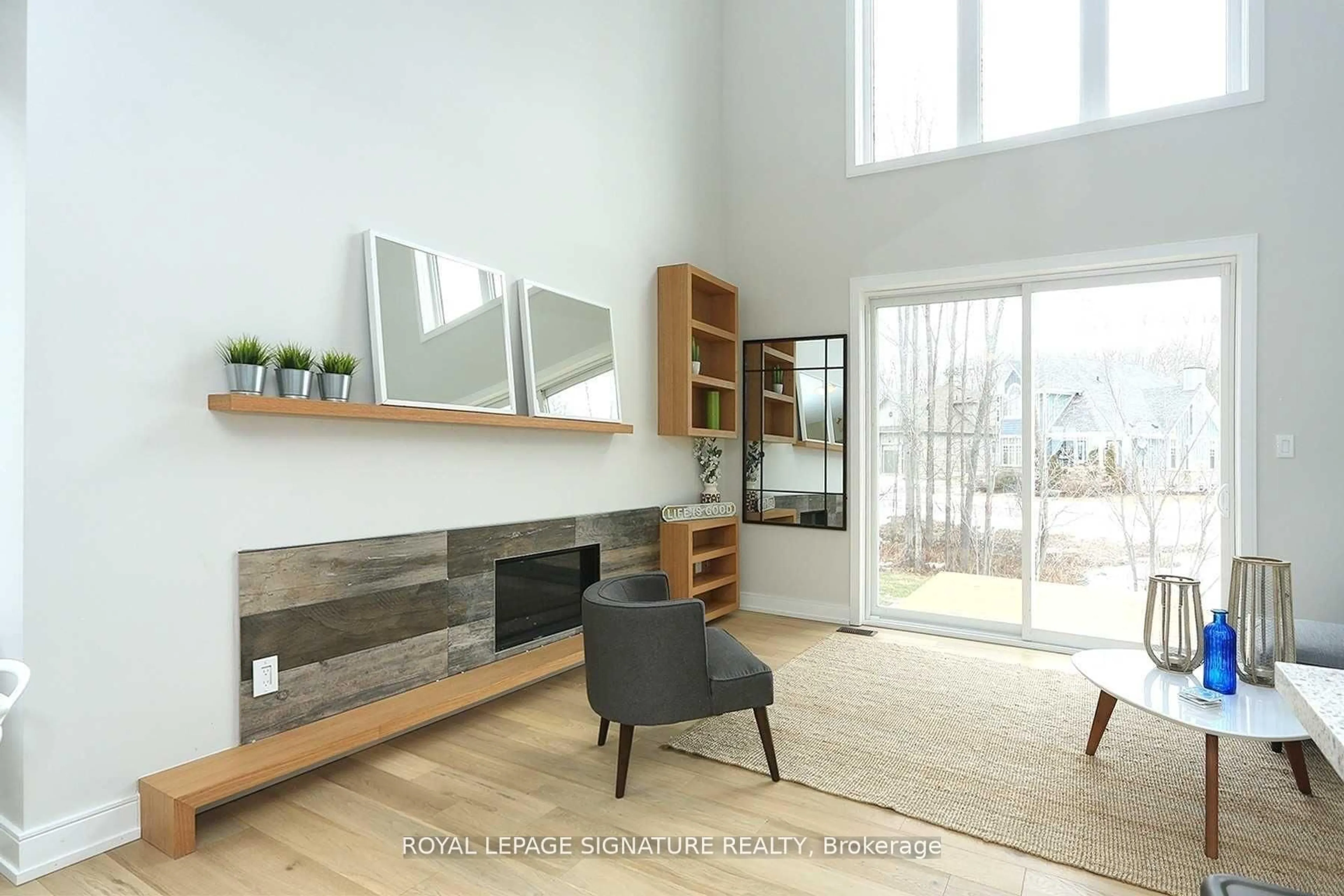 Living room with furniture, wood/laminate floor for 68 Rosedale Tr, Kawartha Lakes Ontario K0M 1N0