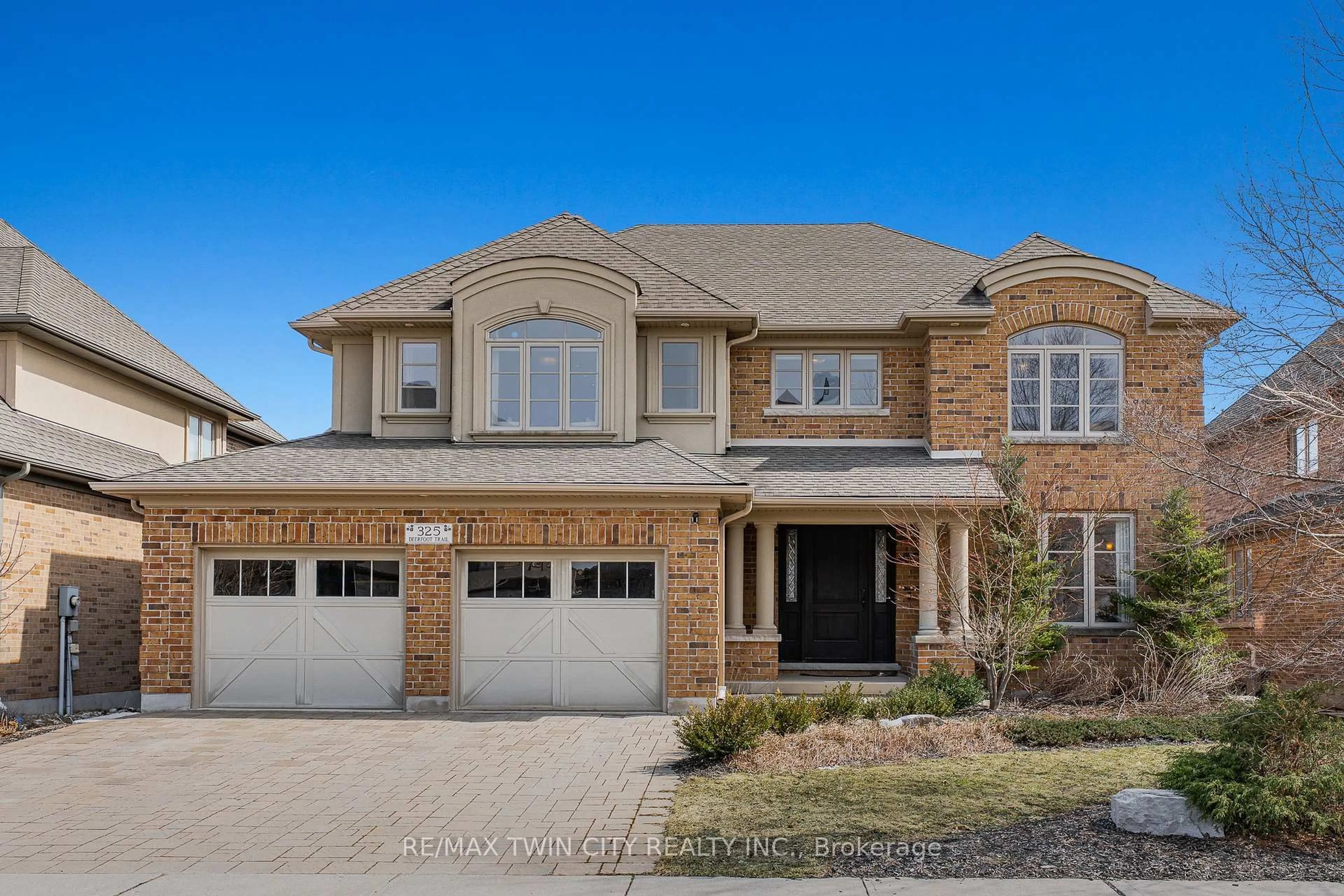 Home with brick exterior material, street for 325 Deerfoot Tr, Waterloo Ontario N2K 0B4