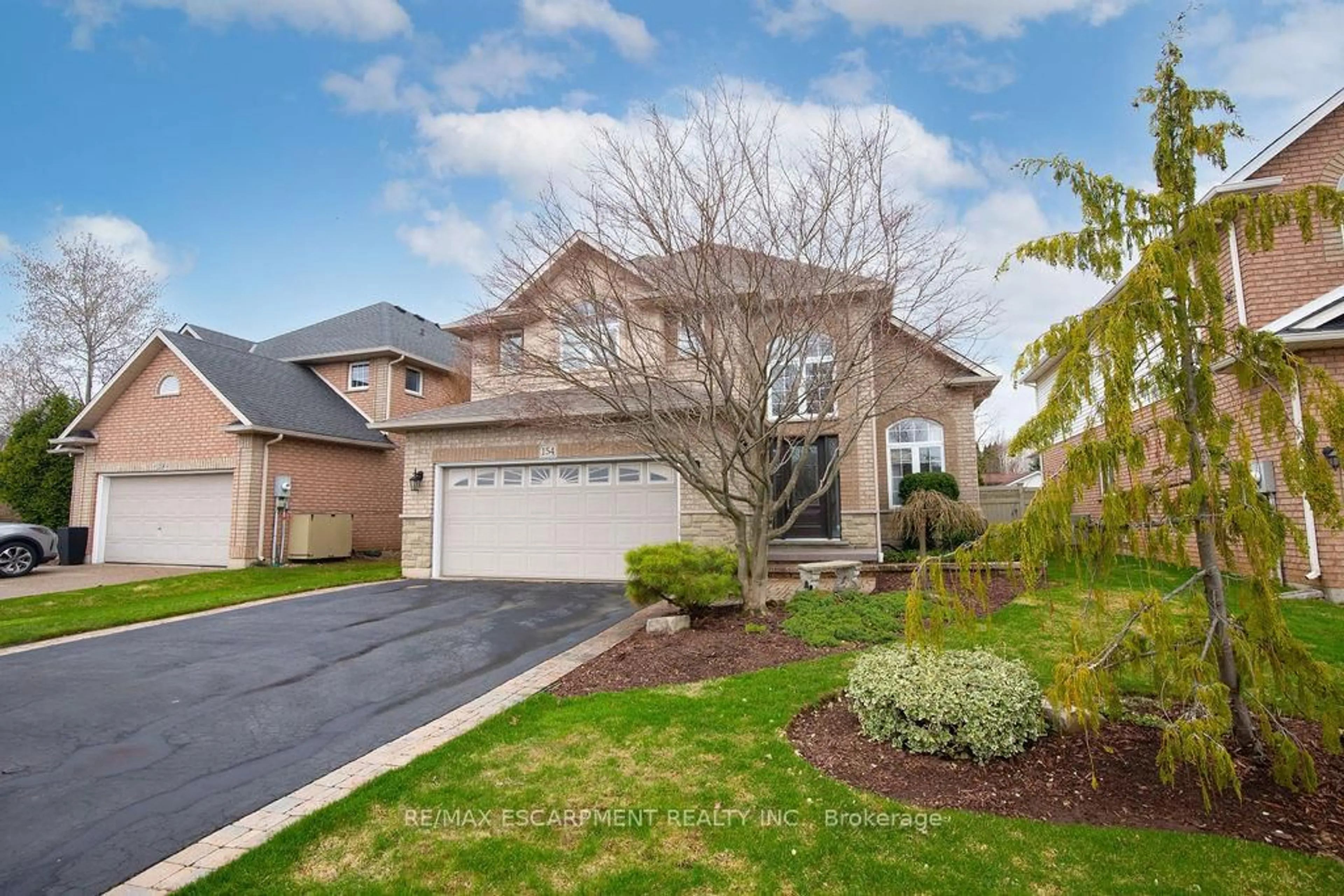 Home with brick exterior material, street for 154 Thoroughbred Blvd, Hamilton Ontario L9K 1M9