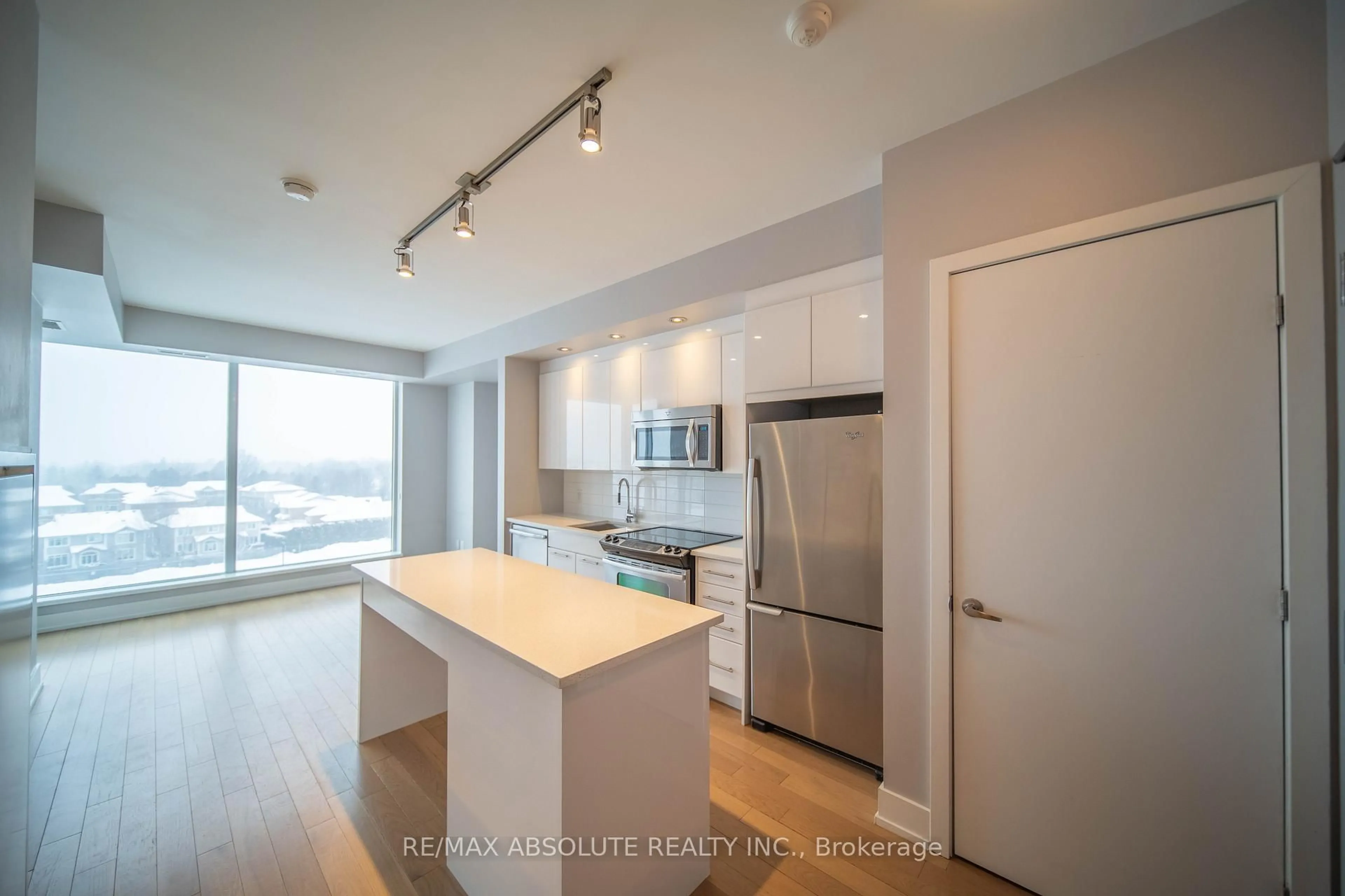 Open concept kitchen, wood/laminate floor for 360 Patricia Ave #607, Ottawa Ontario K1Z 0A8