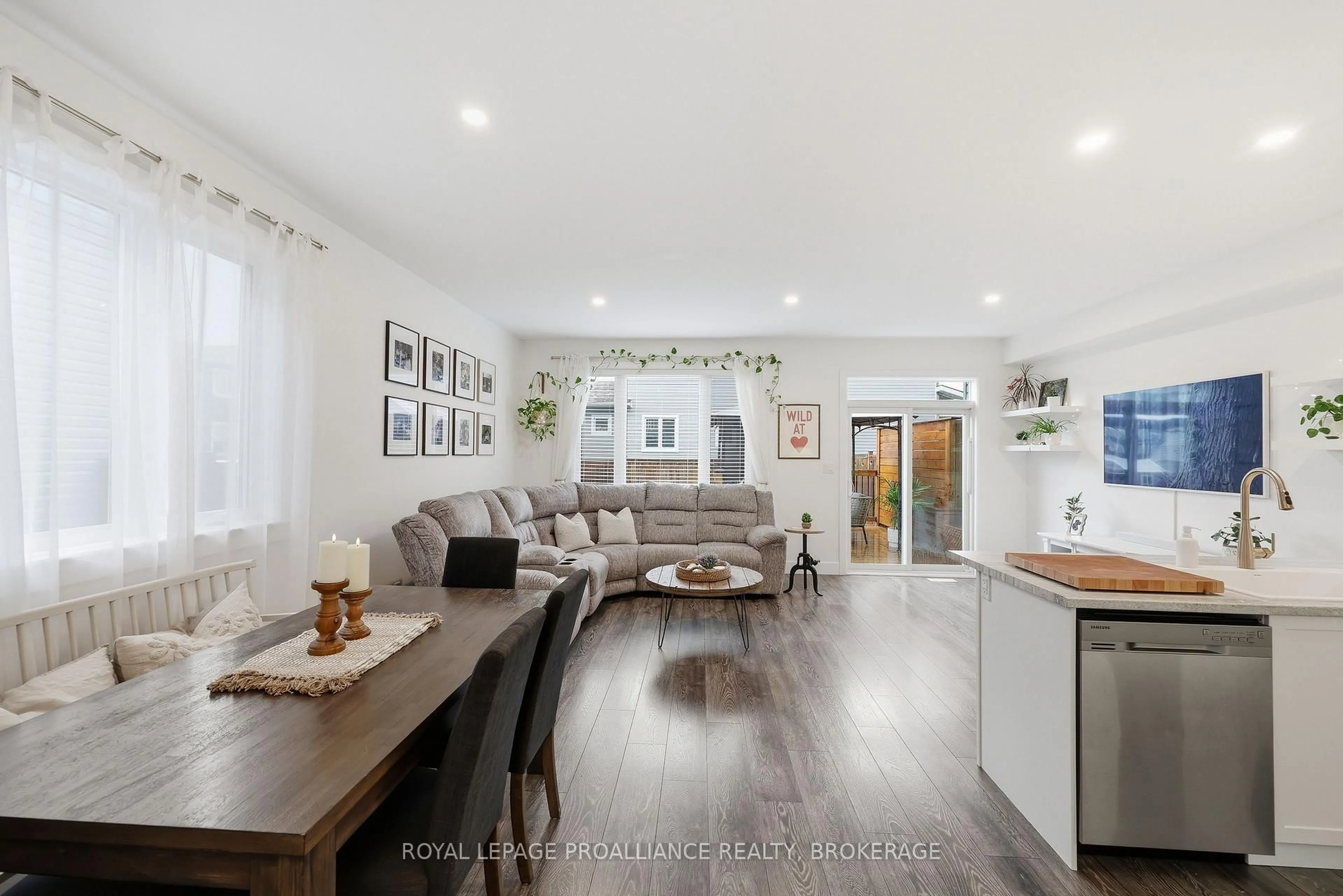 Open concept kitchen, wood/laminate floor for 105 Hazlett St, Loyalist Ontario K7N 0C1