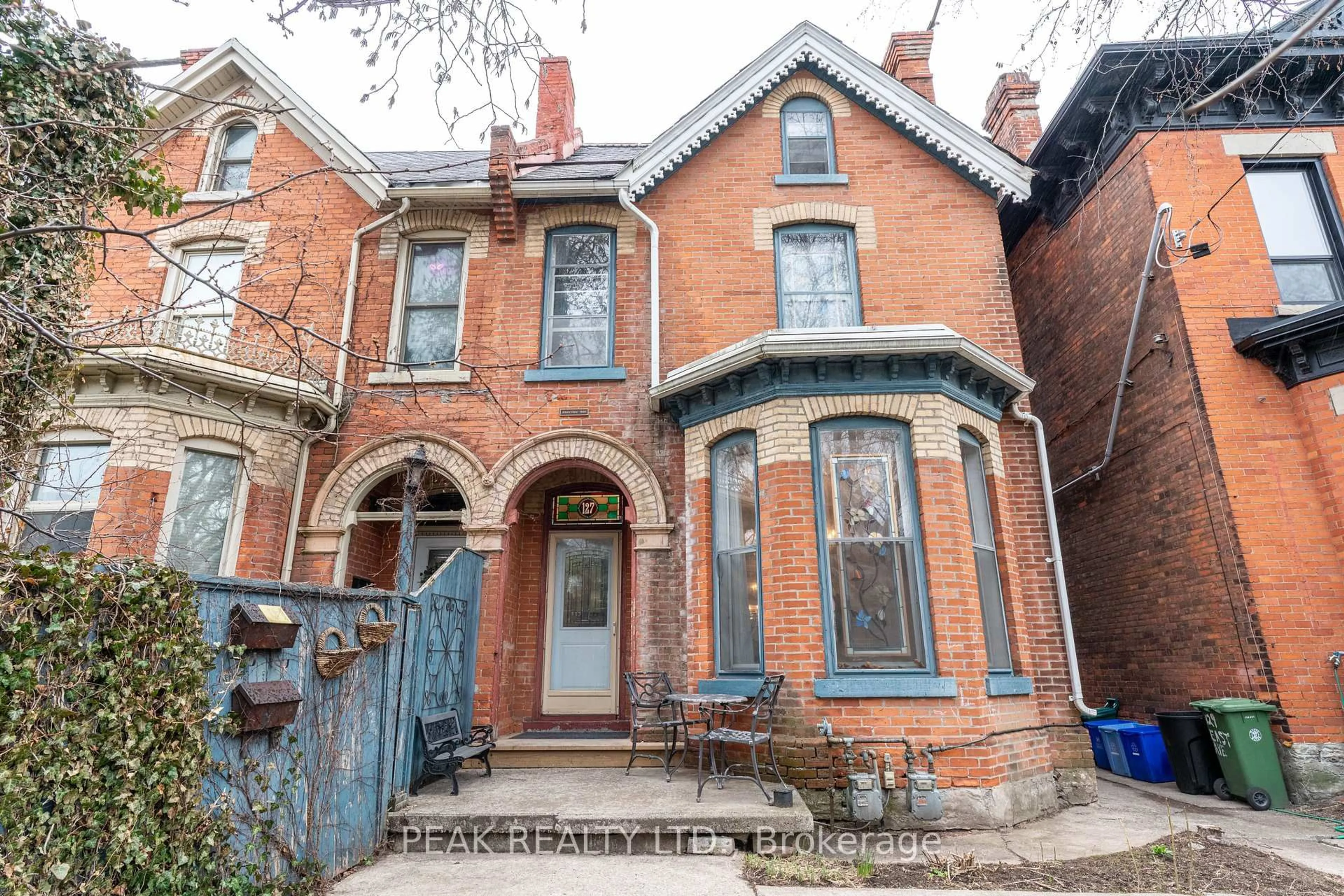 Home with brick exterior material, street for 127 East Ave, Hamilton Ontario L8N 2T6