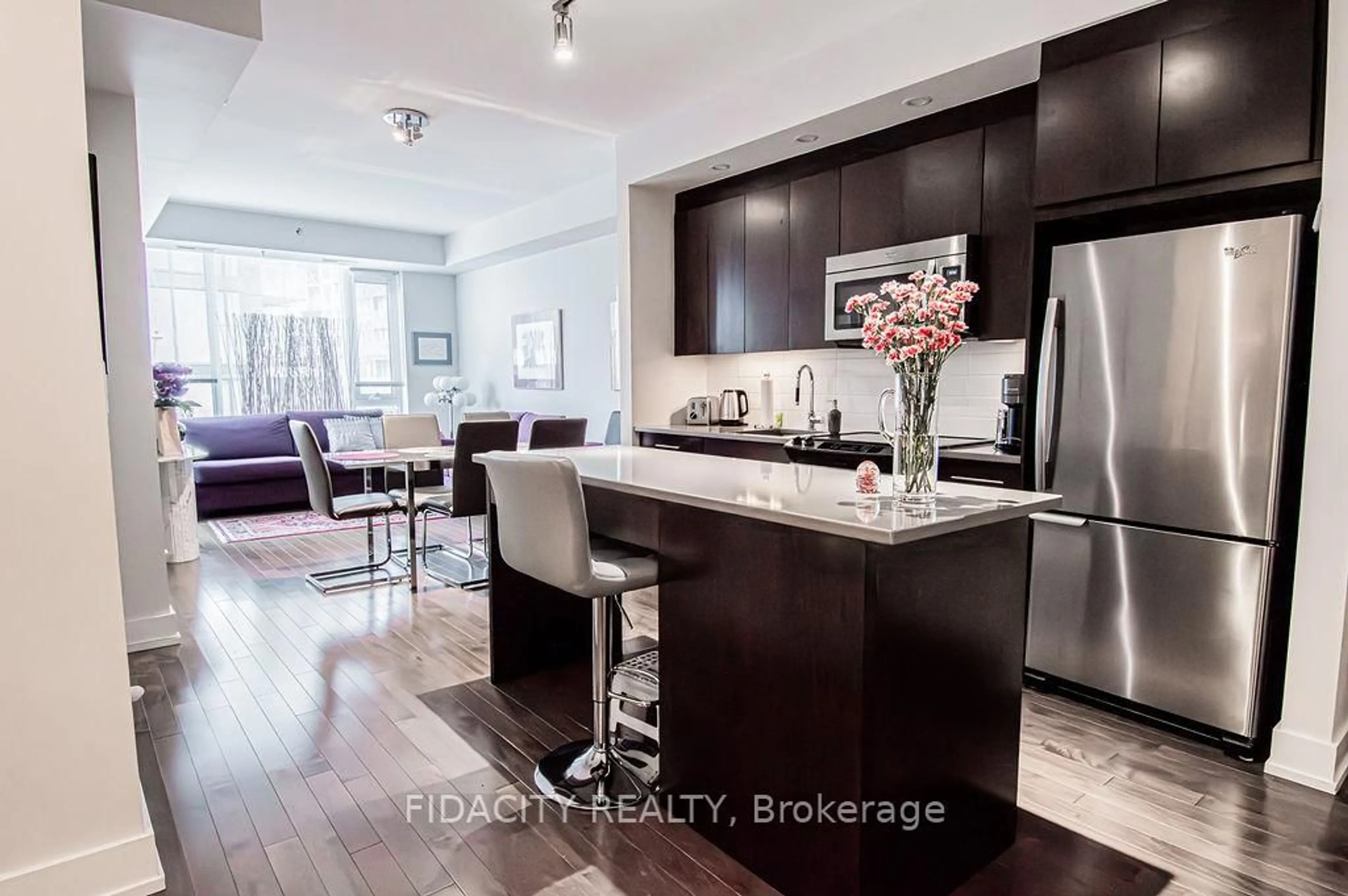 Open concept kitchen, wood/laminate floor for 360 Patricia Ave #324, Ottawa Ontario K1Z 6W1