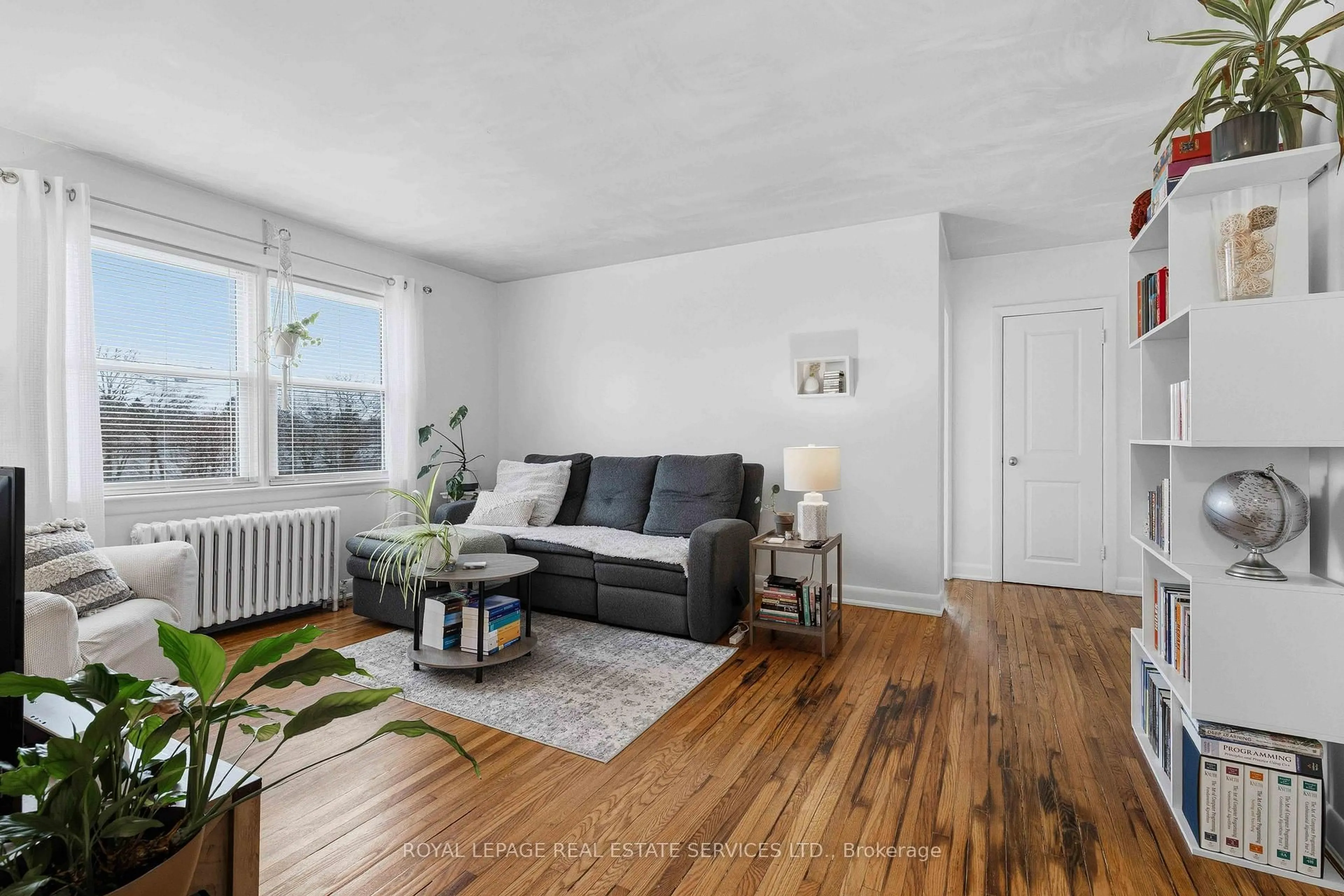 Living room with furniture, wood/laminate floor for 1028 Johnson St, Kingston Ontario K7M 2N4