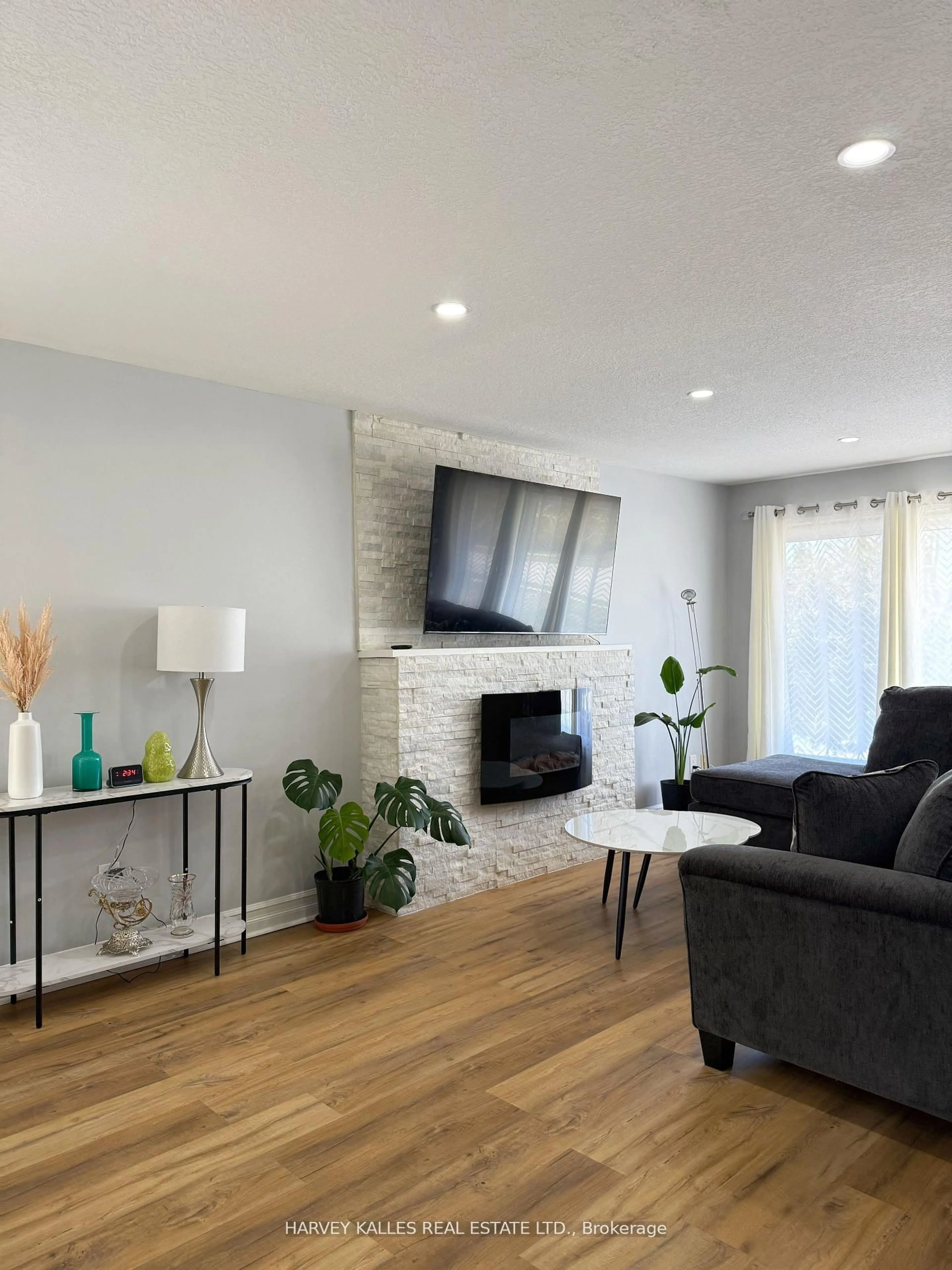 Living room with furniture, wood/laminate floor for 1330 Highbury Ave, London East Ontario N5Y 4W9