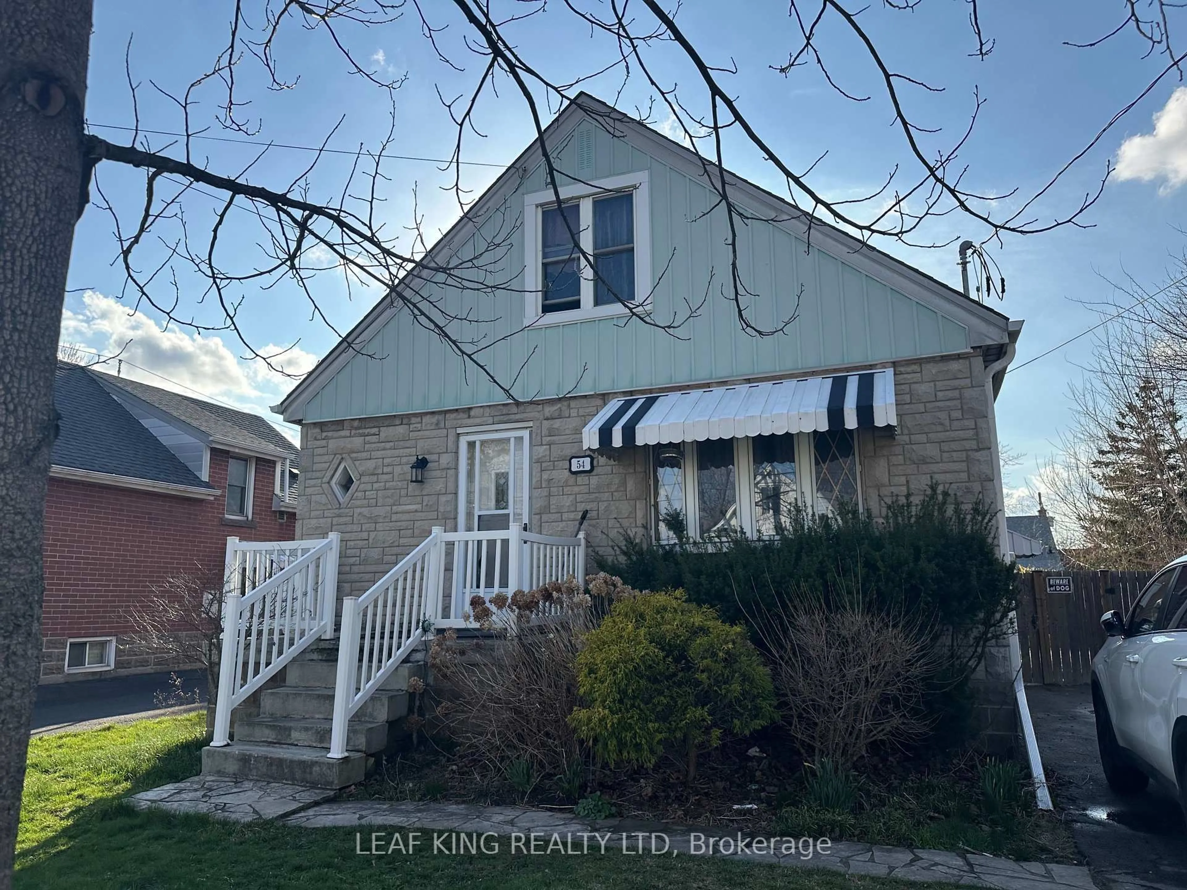 Home with vinyl exterior material, street for 54 West 1st St, Hamilton Ontario L9C 3C1