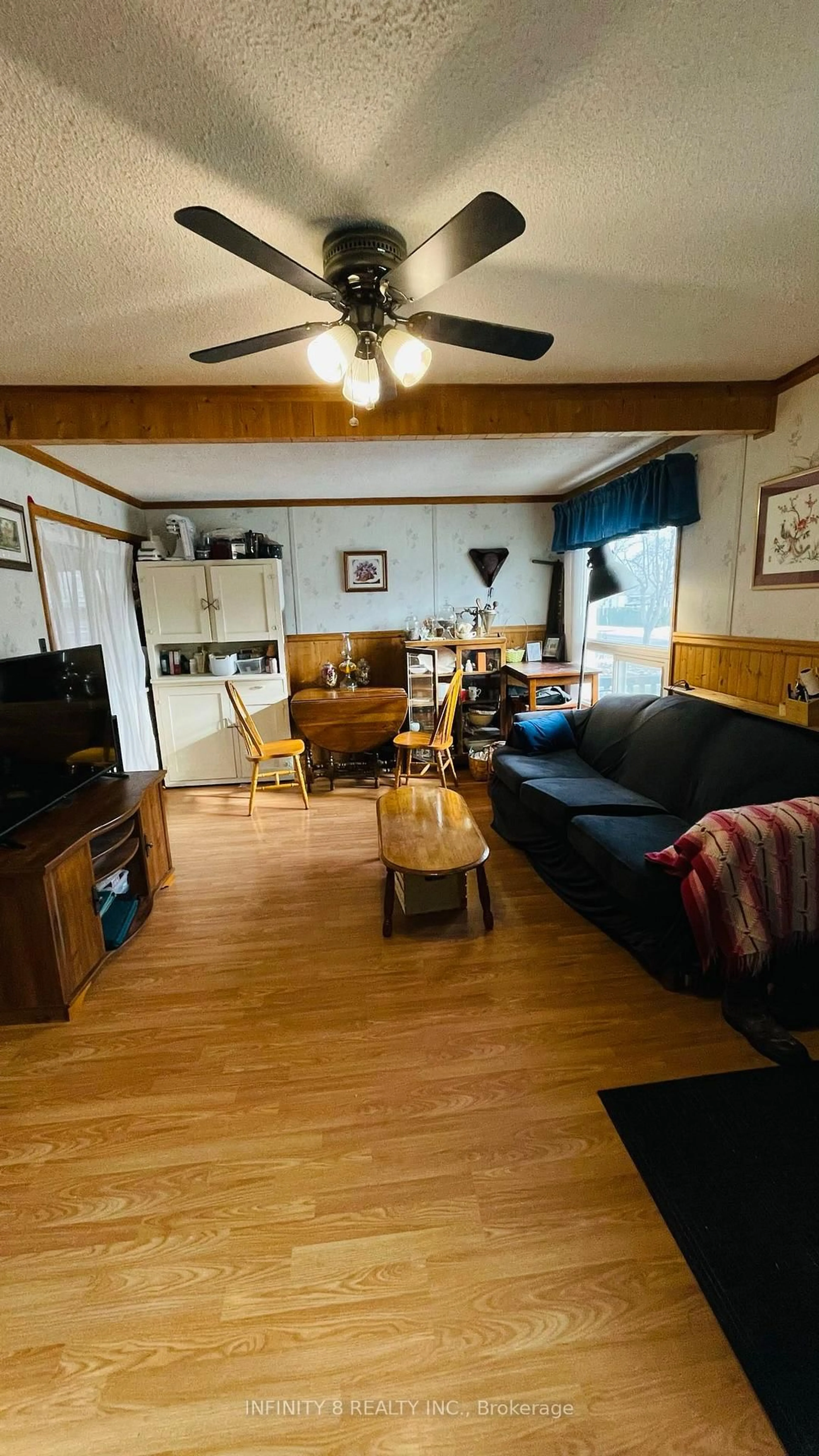 Living room with furniture, wood/laminate floor for 326 Corvette St, Welland Ontario L3B 4S6