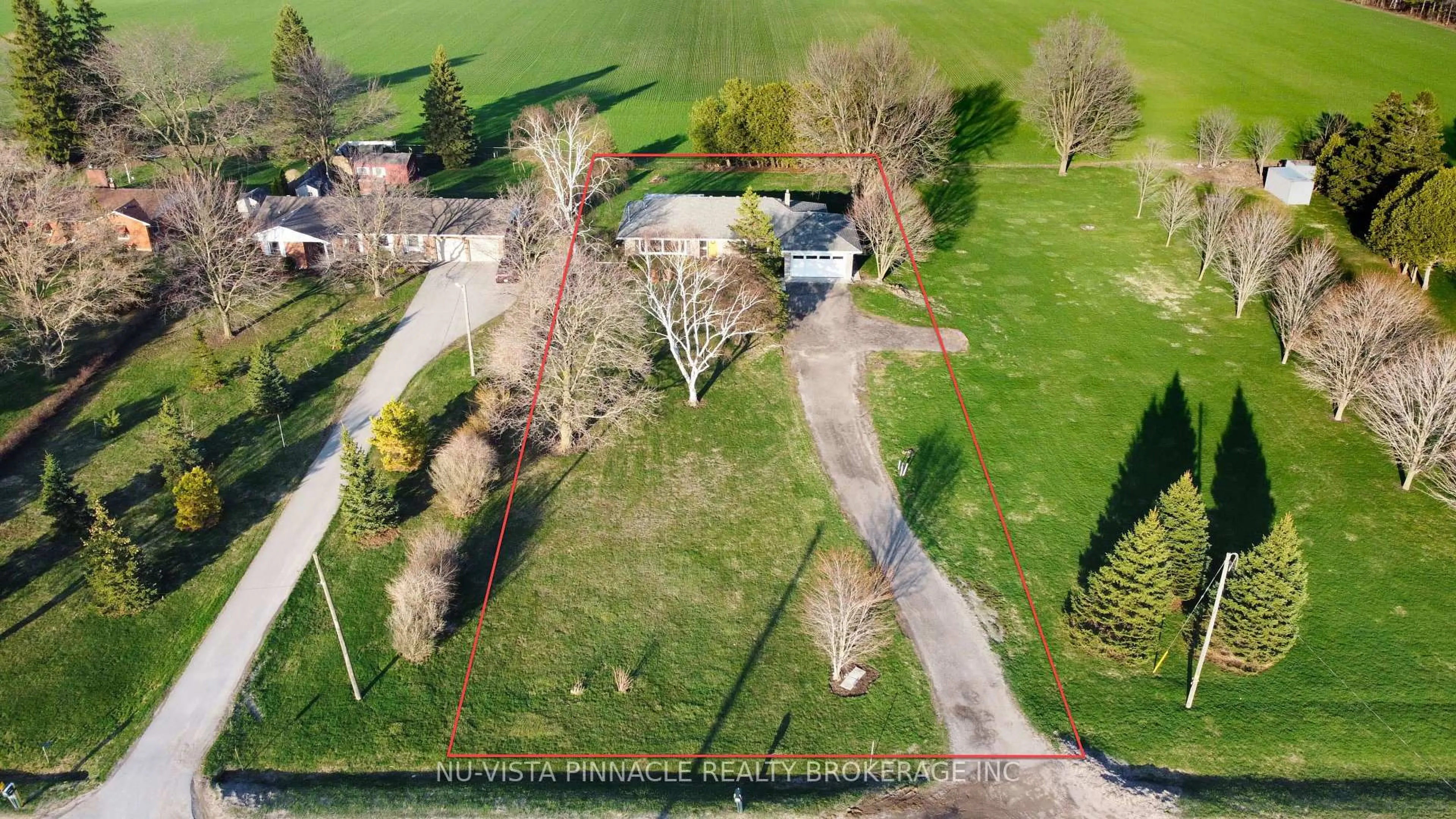 A pic from outside/outdoor area/front of a property/back of a property/a pic from drone, street for 21752 Richmond St, Middlesex Centre Ontario N5X 4B2