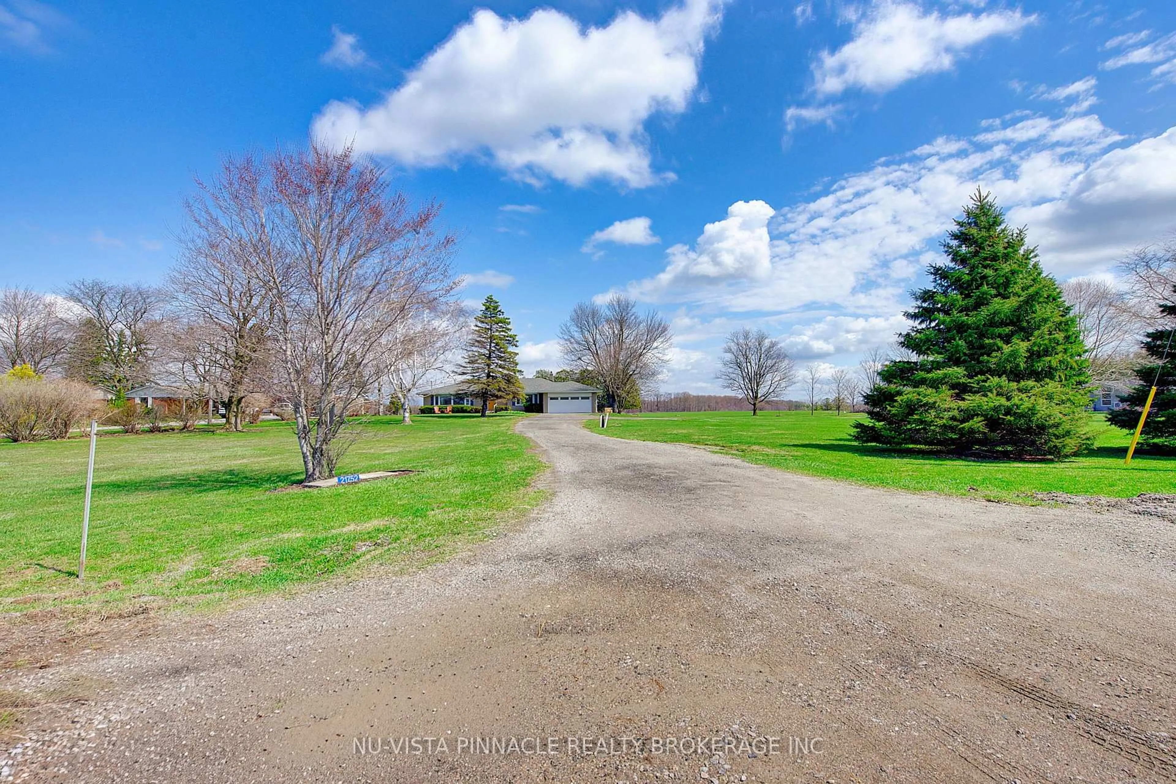 A pic from outside/outdoor area/front of a property/back of a property/a pic from drone, water/lake/river/ocean view for 21752 Richmond St, Middlesex Centre Ontario N5X 4B2