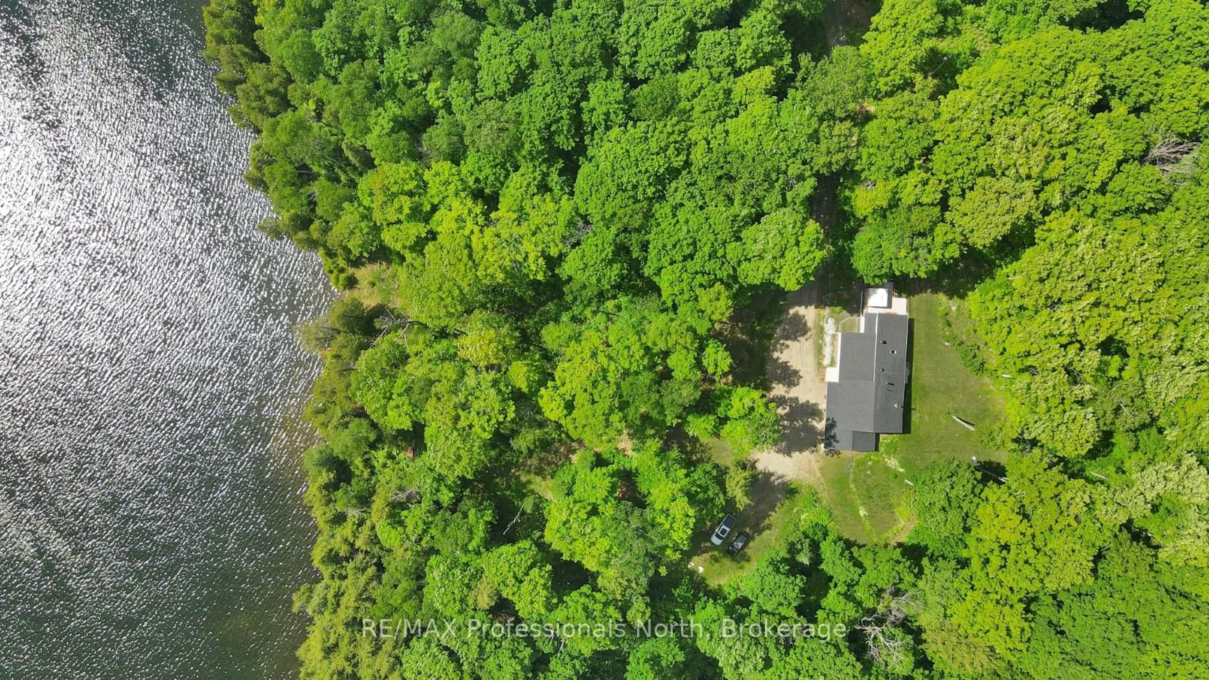 A pic from outside/outdoor area/front of a property/back of a property/a pic from drone, water/lake/river/ocean view for 1930 Trappers Tr, Dysart et al Ontario K0M 1S0