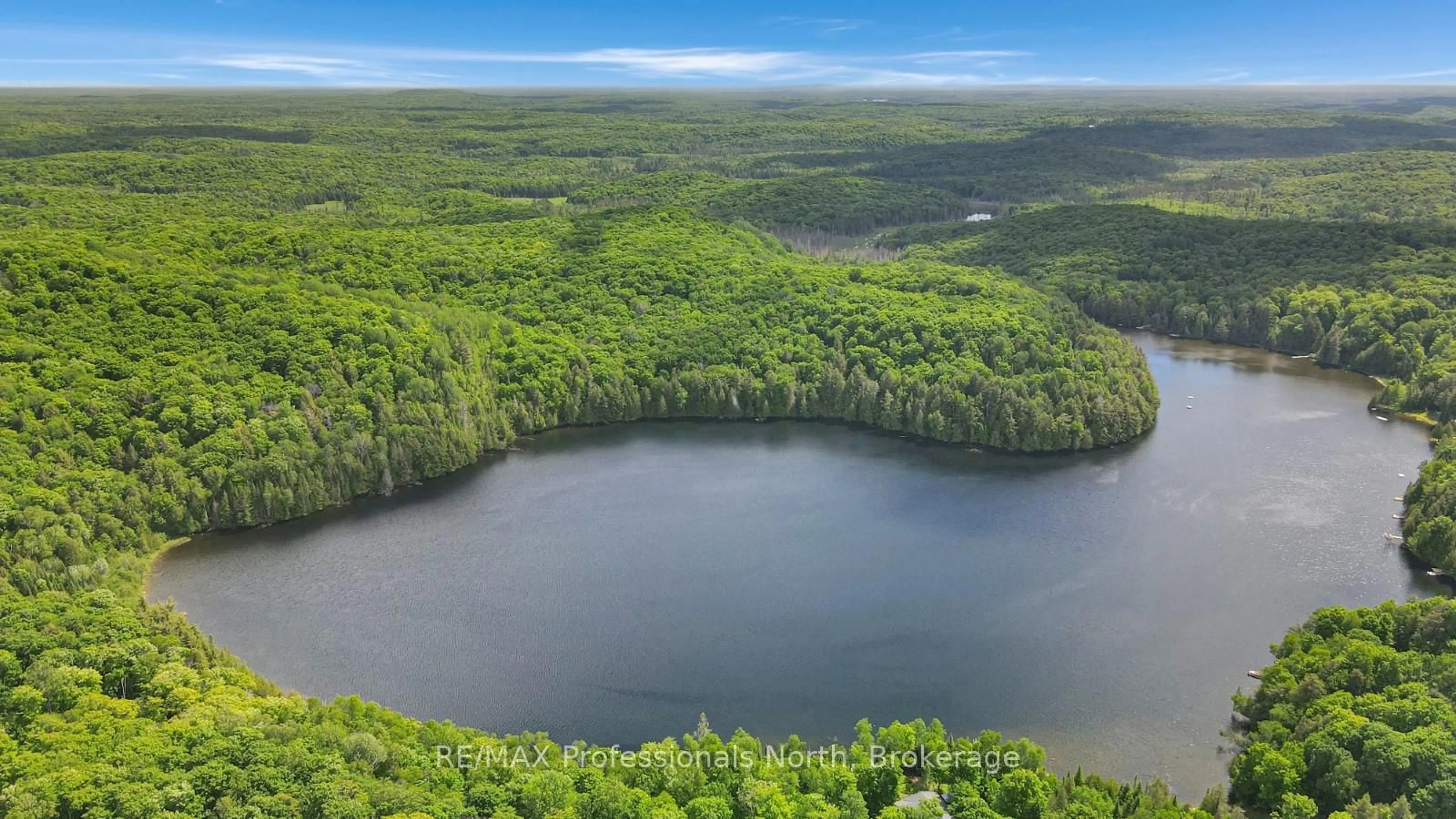 A pic from outside/outdoor area/front of a property/back of a property/a pic from drone, water/lake/river/ocean view for 1930 Trappers Tr, Dysart et al Ontario K0M 1S0