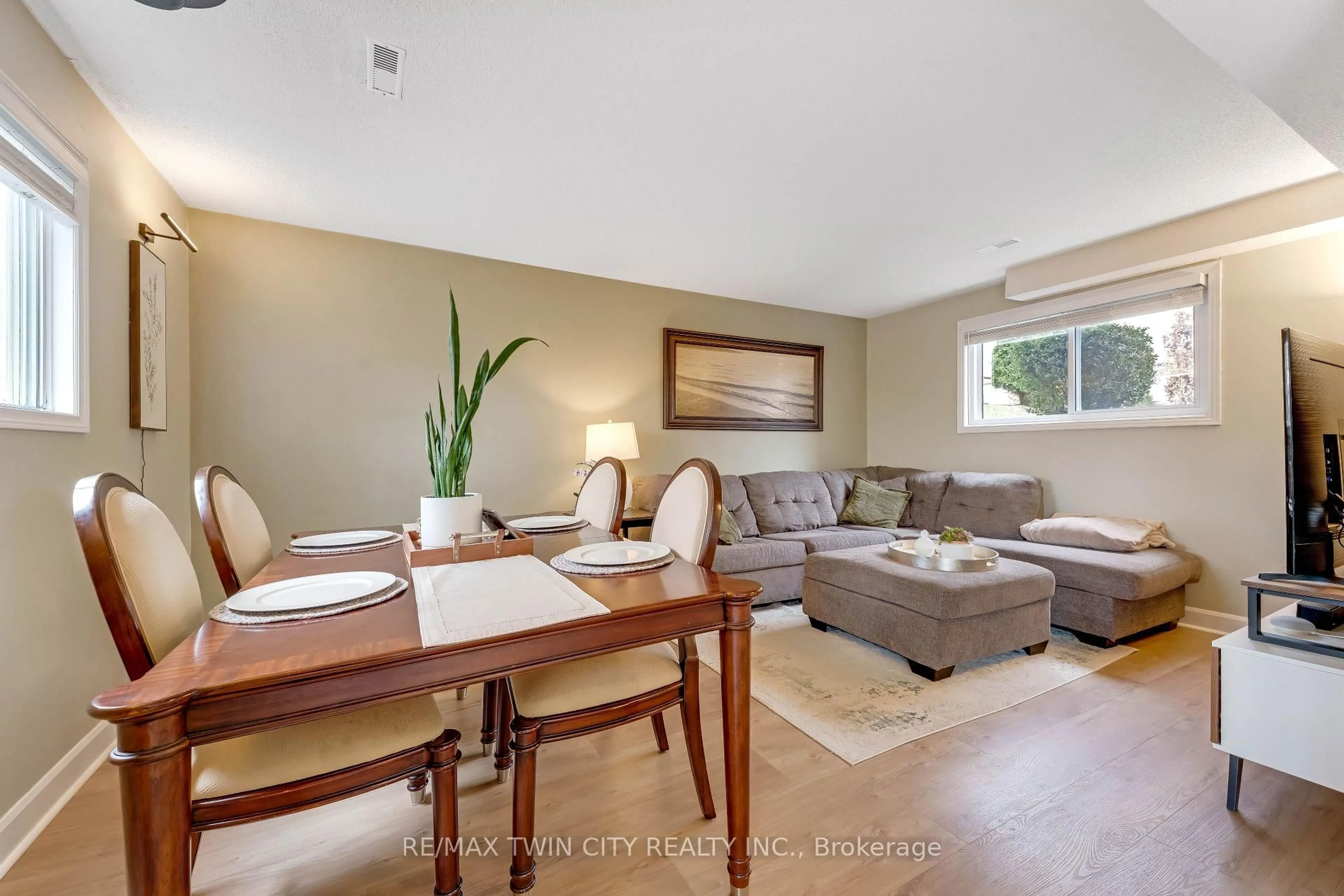 Living room with furniture, wood/laminate floor for 99 Canrobert St, Woodstock Ontario N4S 8X5