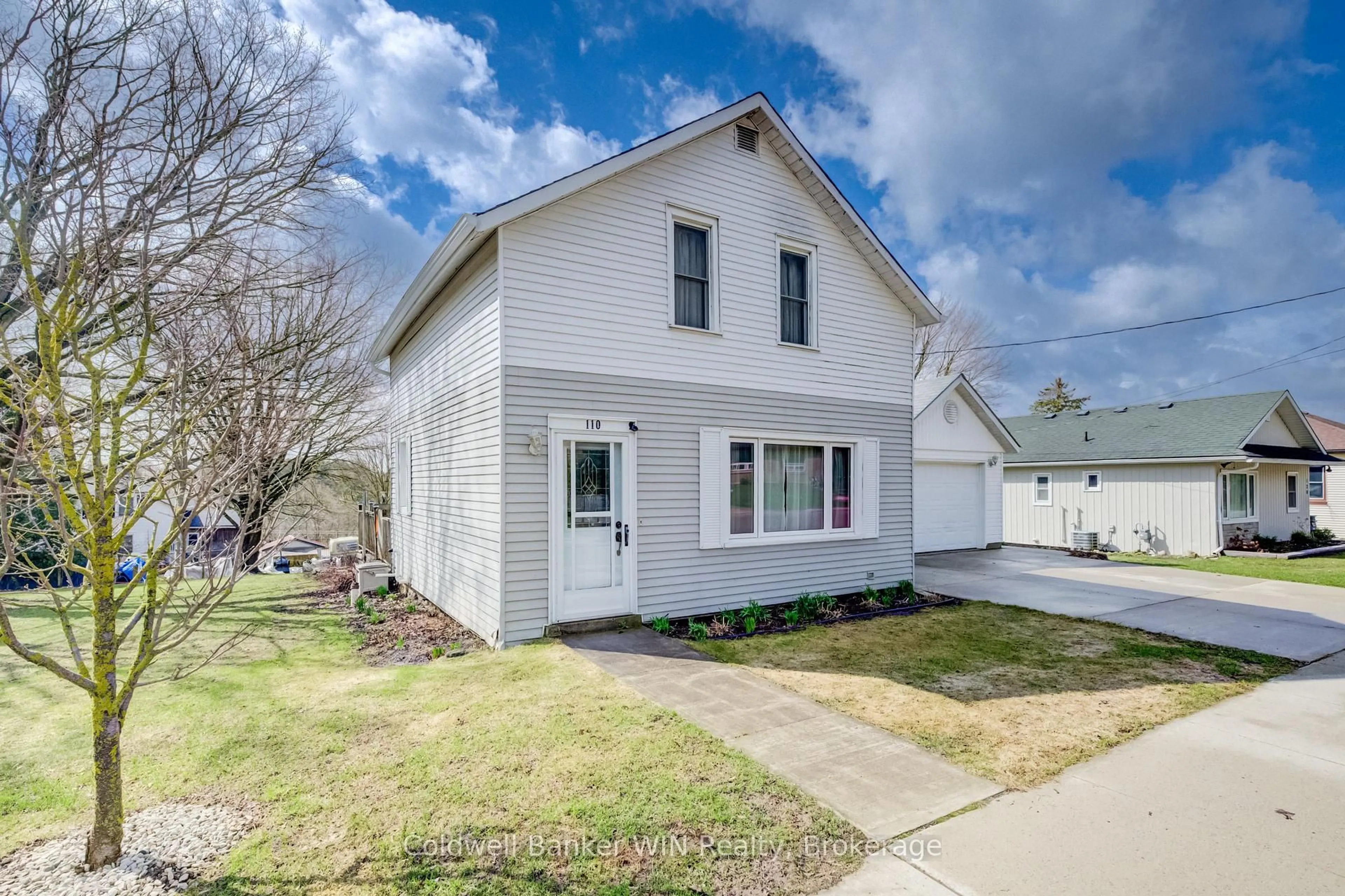 Home with vinyl exterior material, street for 110 Miller St, Wellington North Ontario N0G 2L3