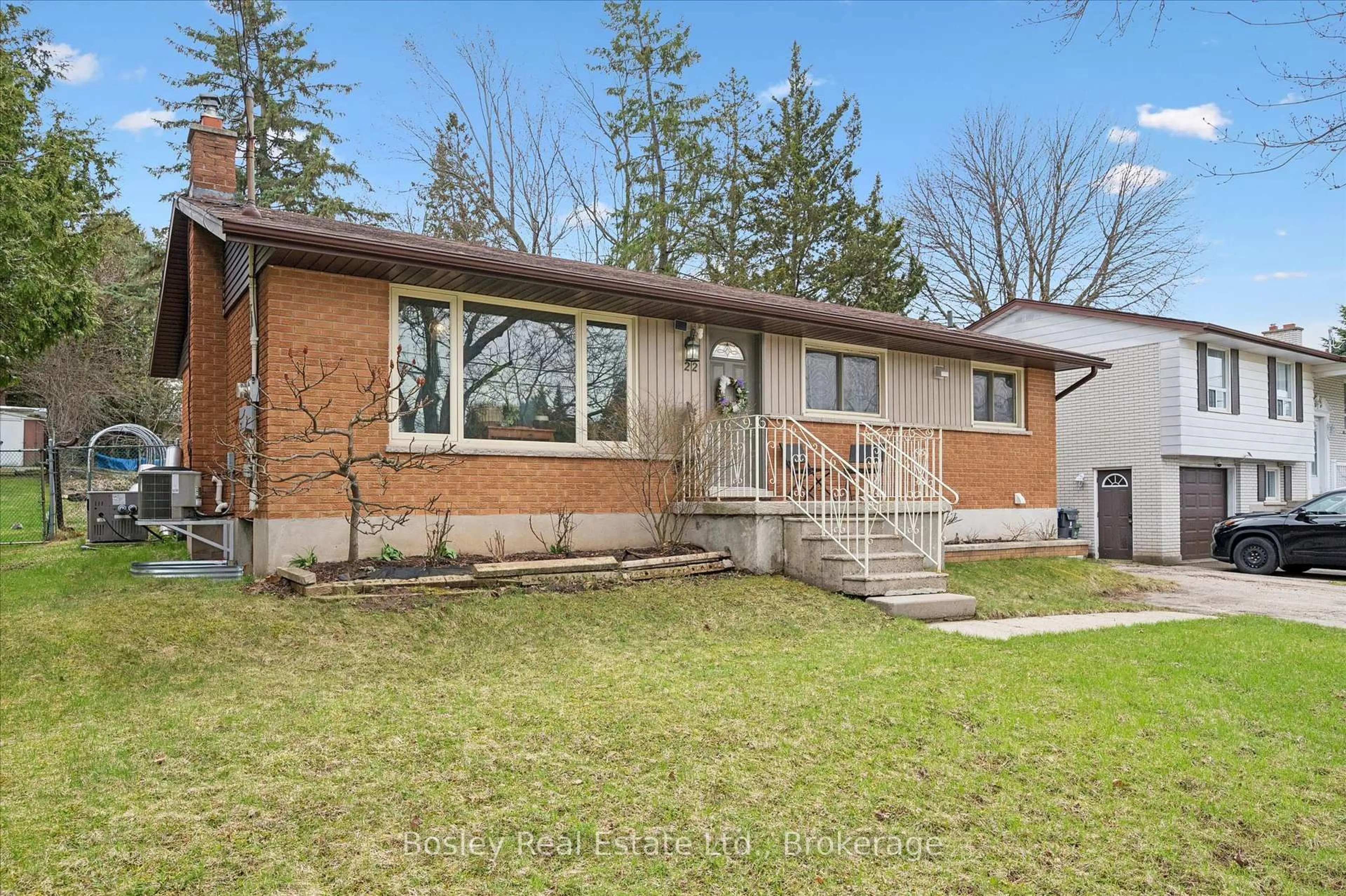 Home with brick exterior material, street for 22 Delaware Ave, Guelph Ontario N1E 3V4