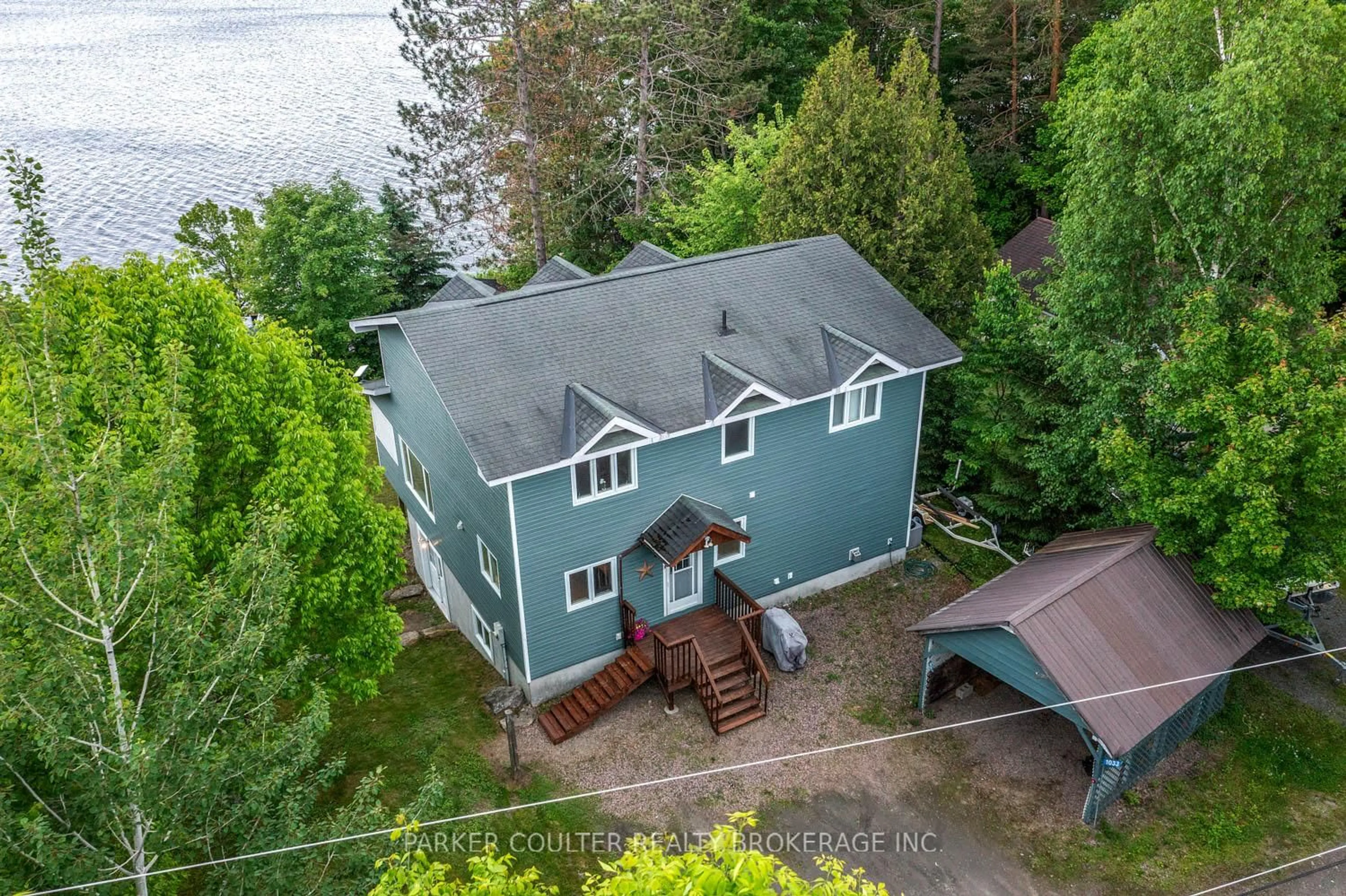 A pic from outside/outdoor area/front of a property/back of a property/a pic from drone, water/lake/river/ocean view for 1033 Harvest Moon Lane, Algonquin Highlands Ontario K0M 1S0