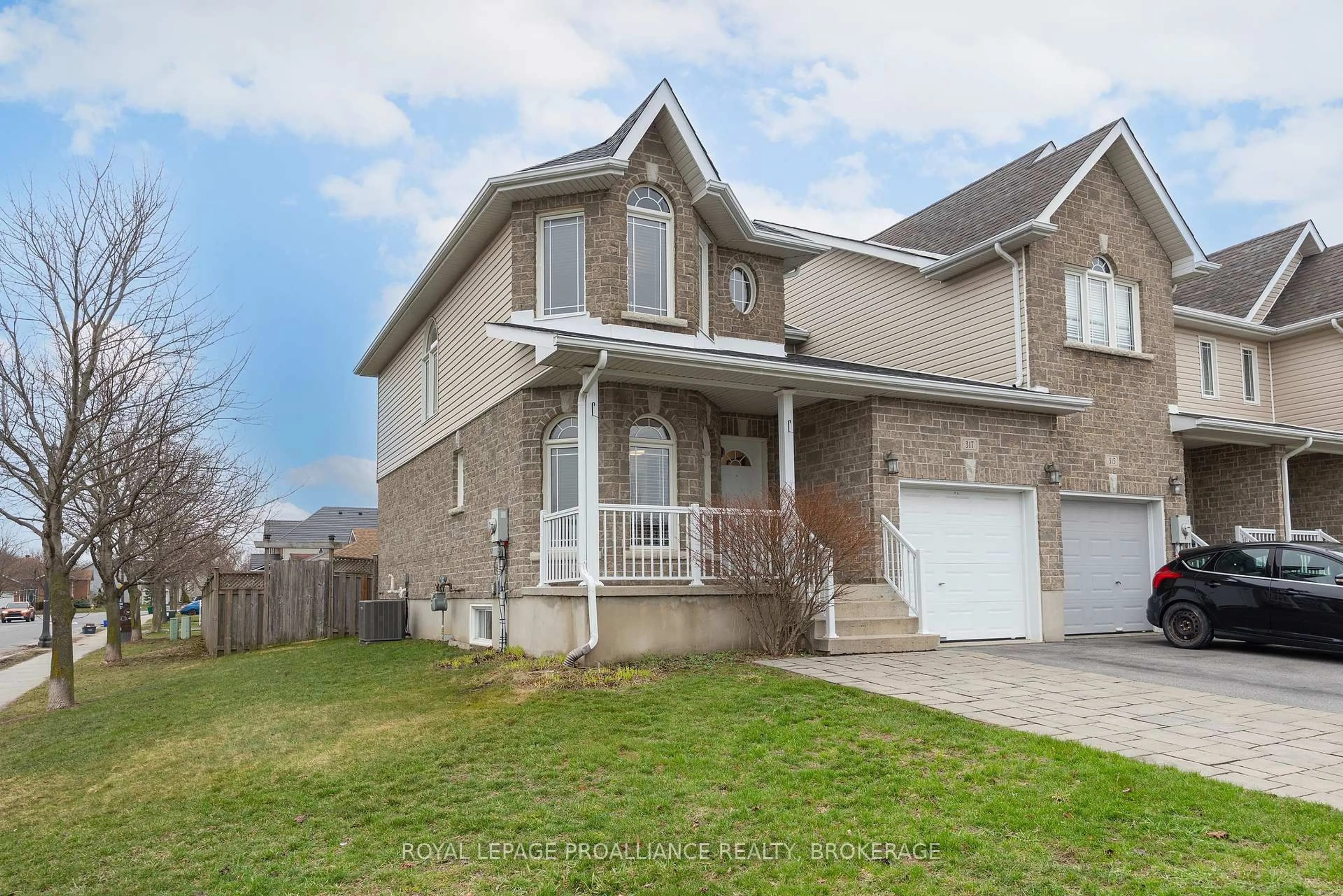 Home with brick exterior material, street for 317 Rose Abbey Dr, Kingston Ontario K7K 0A4