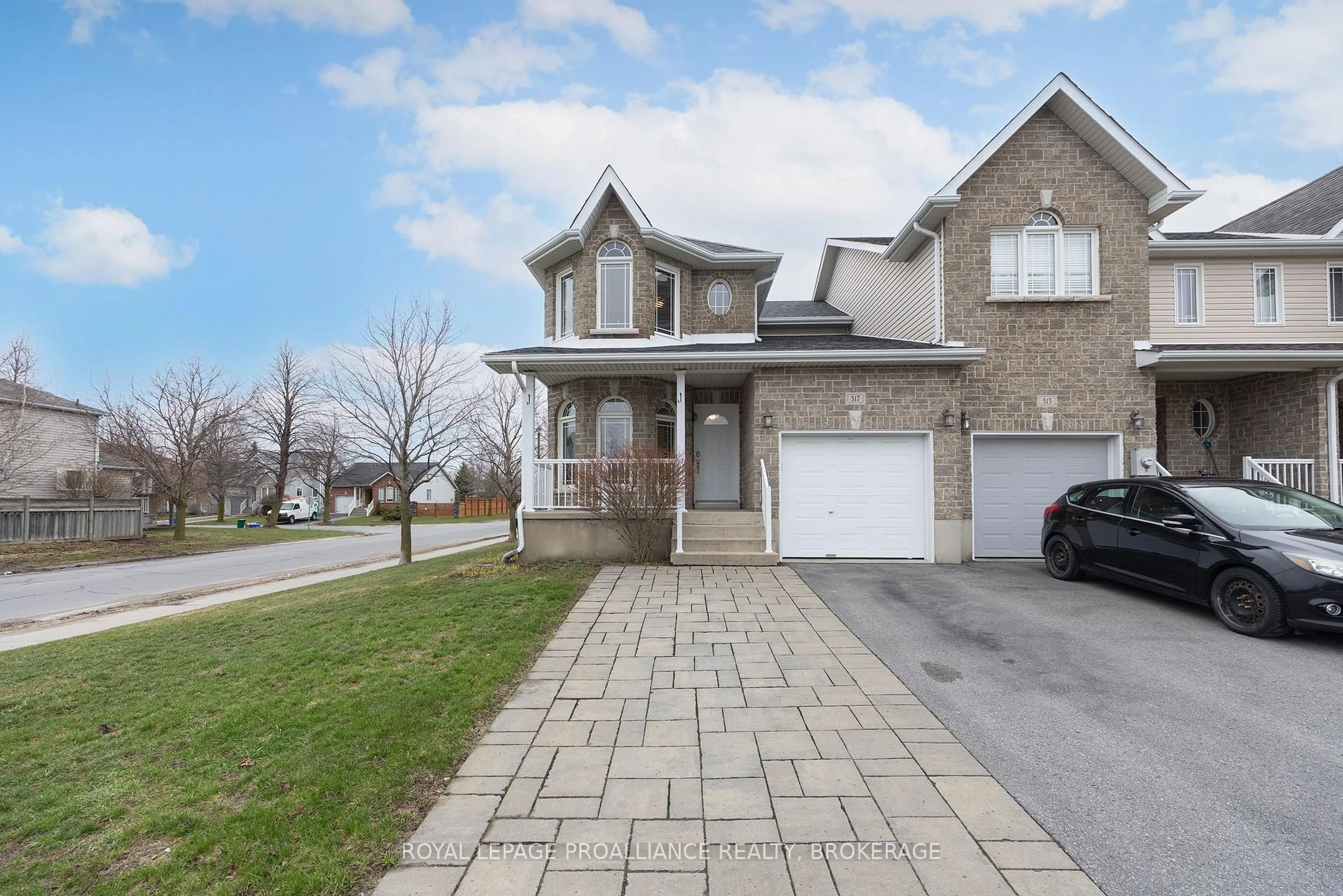 Home with brick exterior material, street for 317 Rose Abbey Dr, Kingston Ontario K7K 0A4